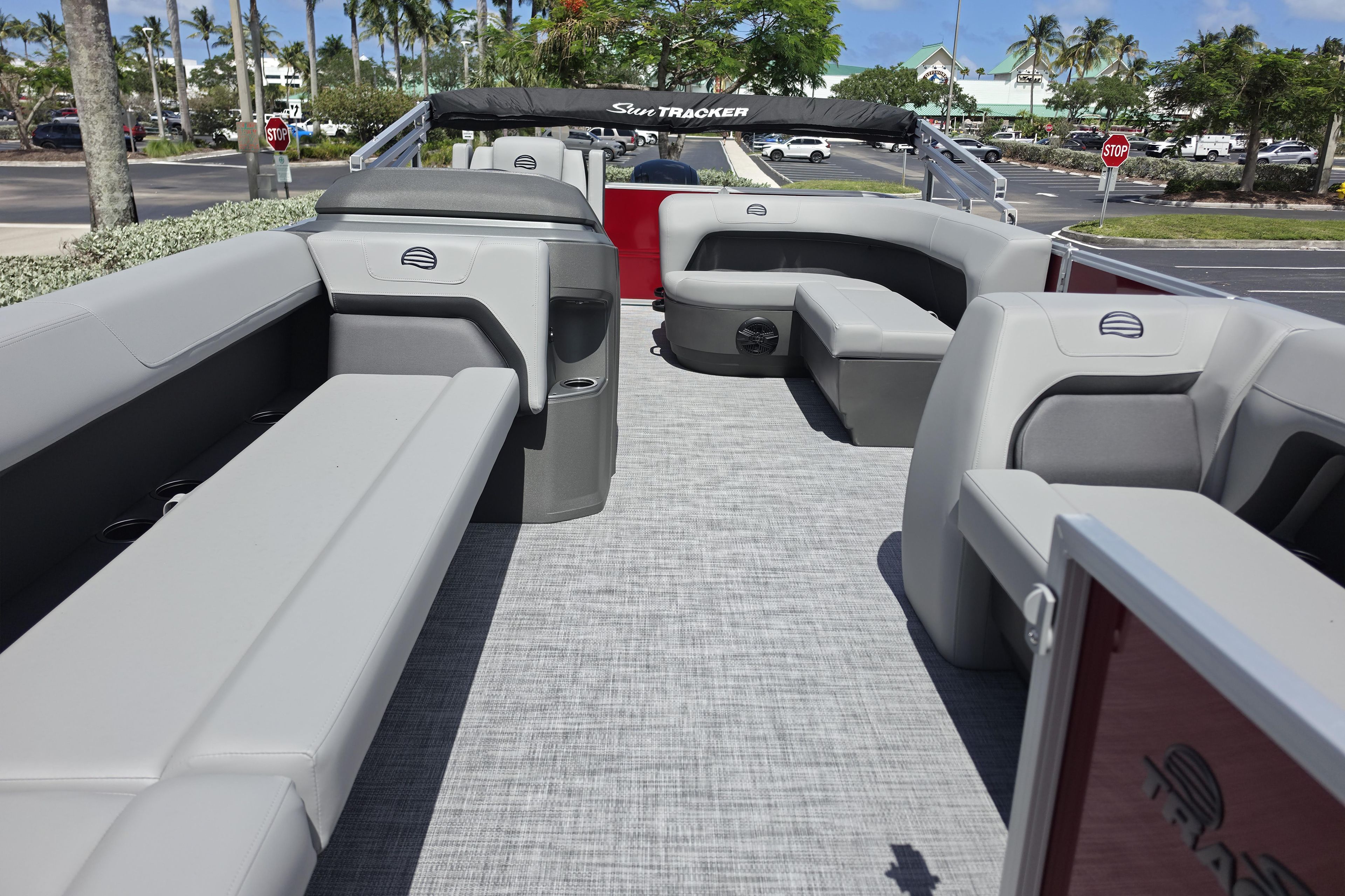 2026 Sun Tracker Party Barge 18 DLX interior with gray seating and spacious layout.
