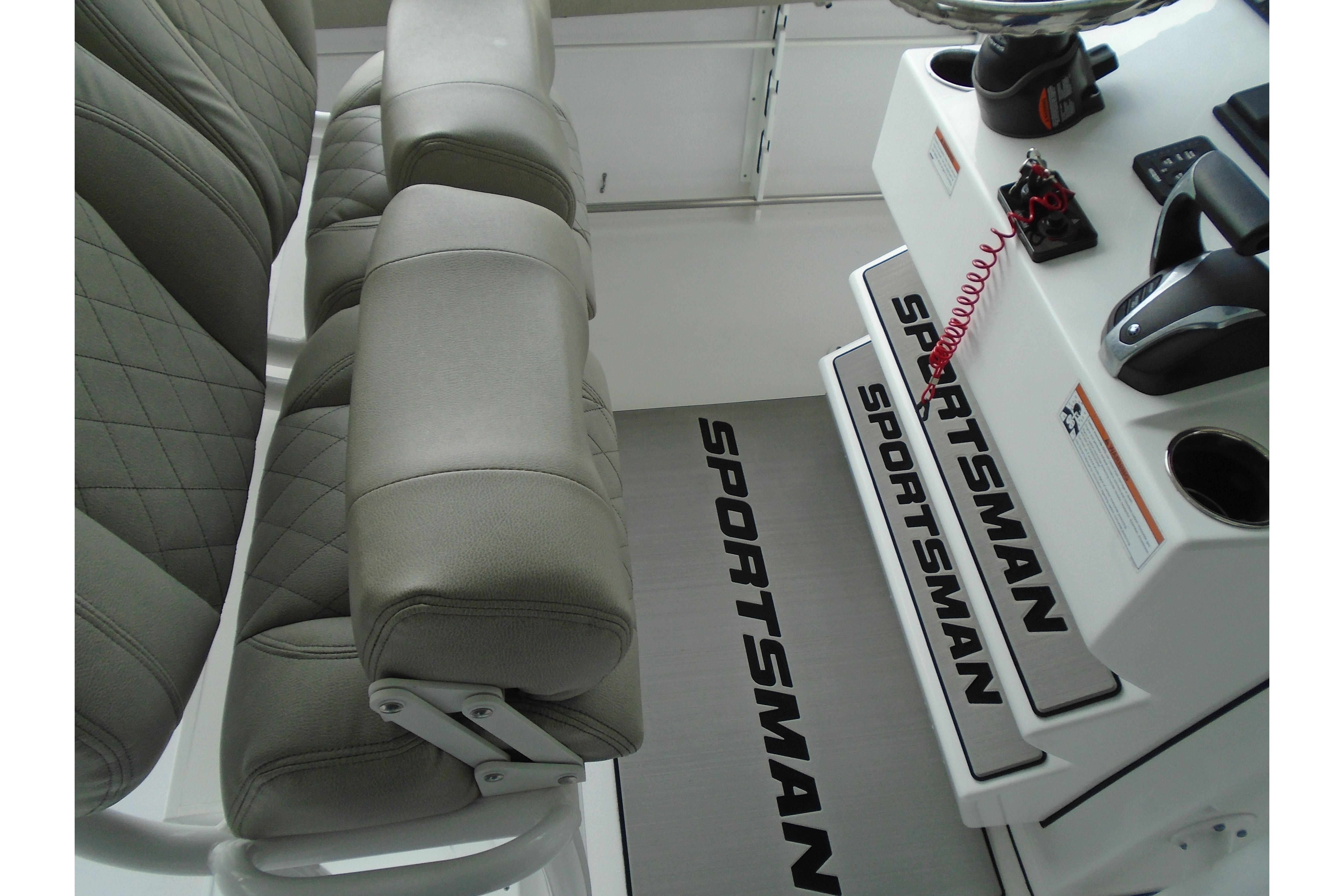2022 Sportsman Heritage 241 Center Console interior with cushioned seating and control panel.
