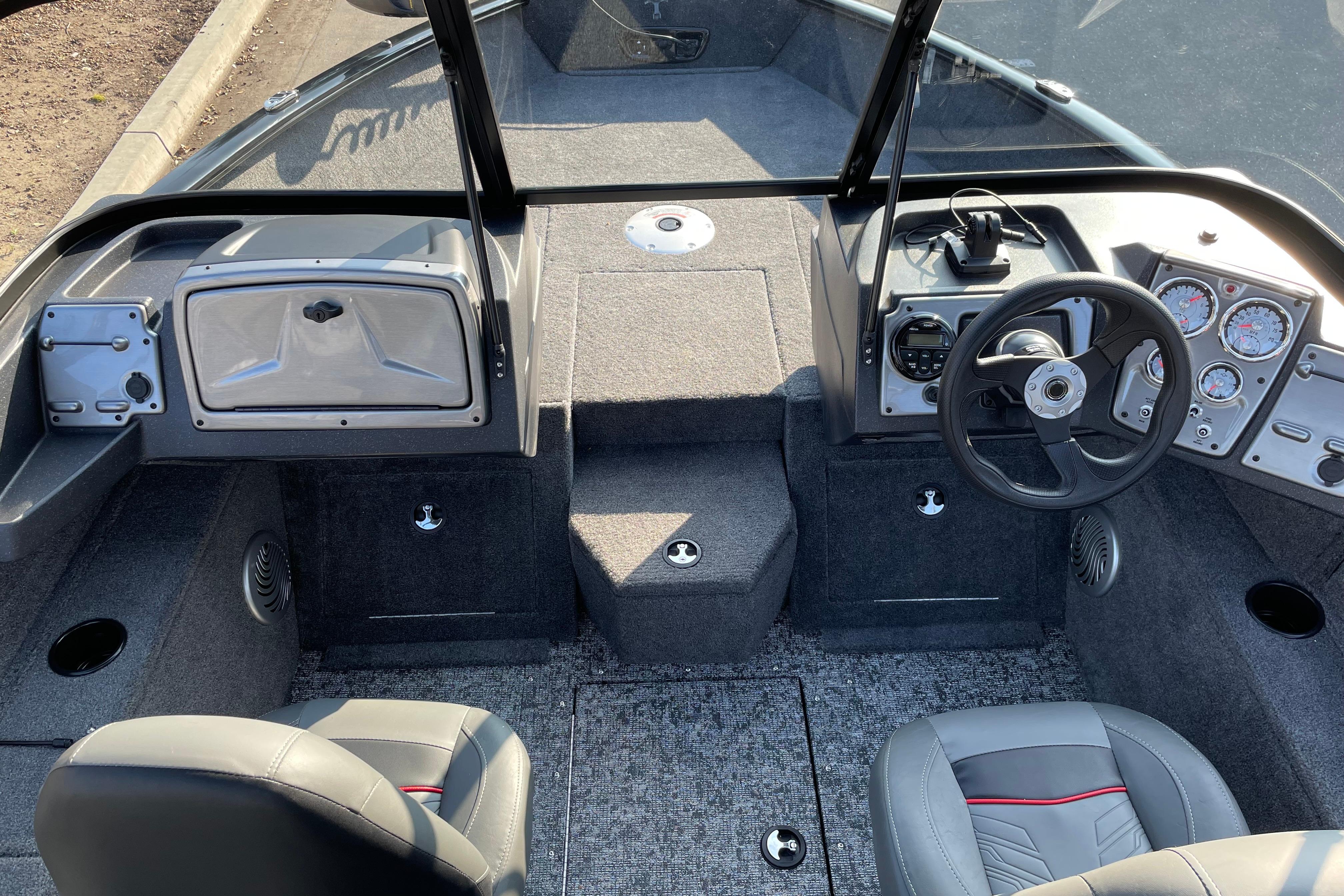 2026 Tracker Pro Guide V-175 WT boat interior with steering wheel and seating.