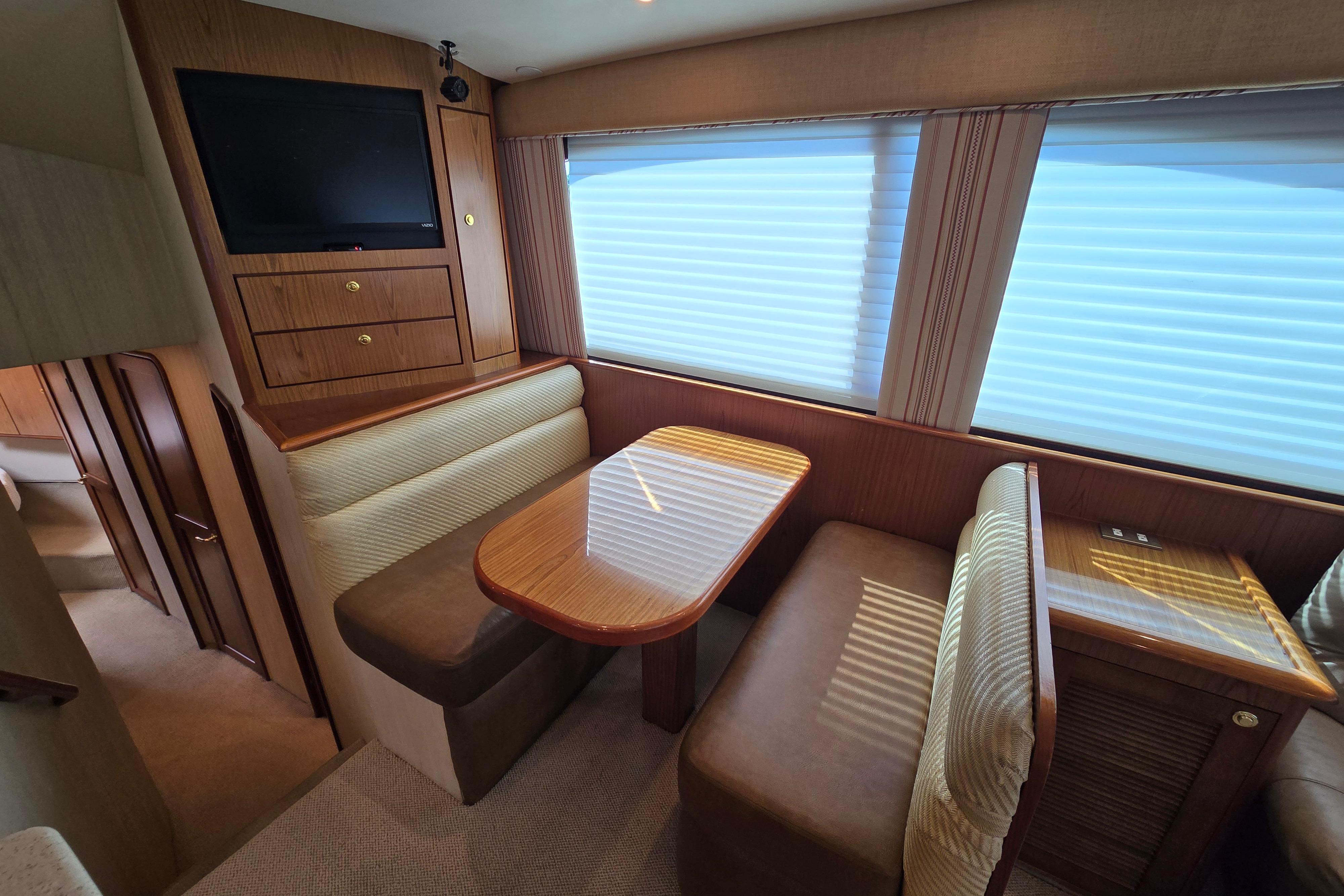 2007 Ocean Yachts 46 Super Sport interior with dining area and TV.