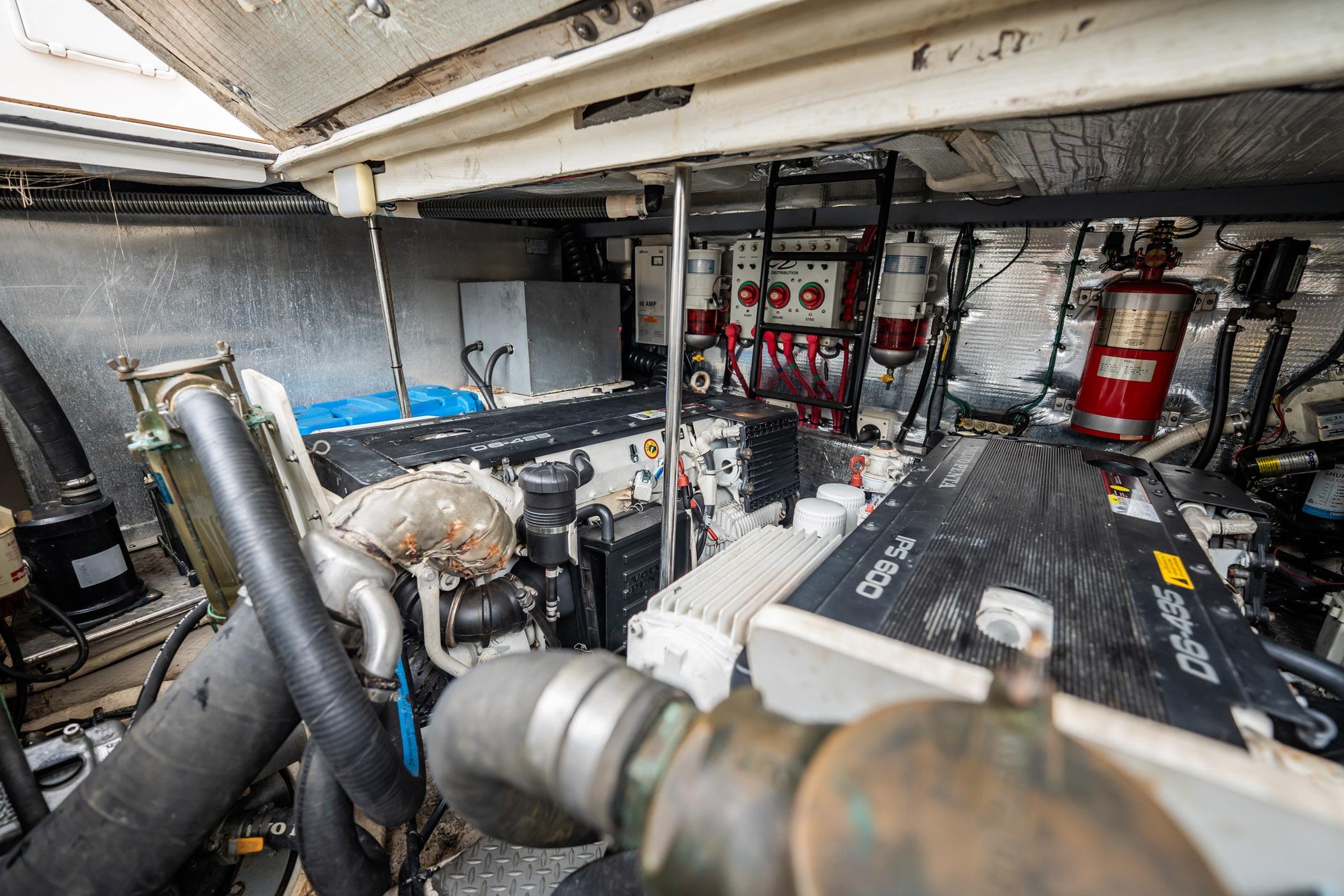 Engine room of a 2008 Regal Commodore 4460 yacht, showcasing mechanical components.
