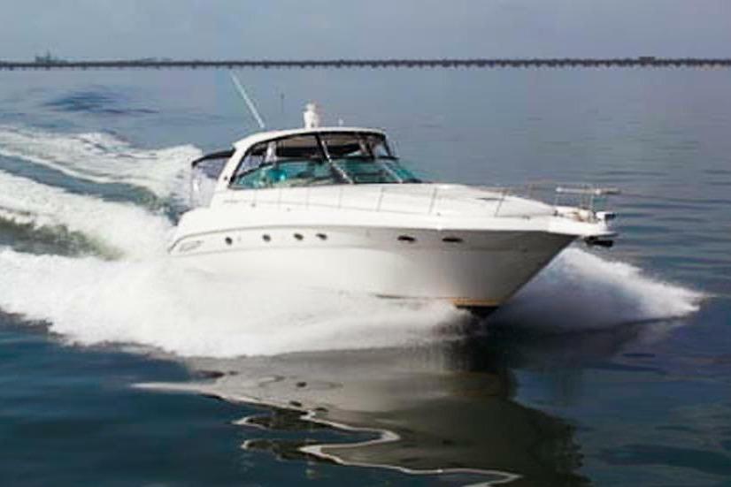 2003 Sea Ray Sundancer 460 yacht cruising on calm waters.