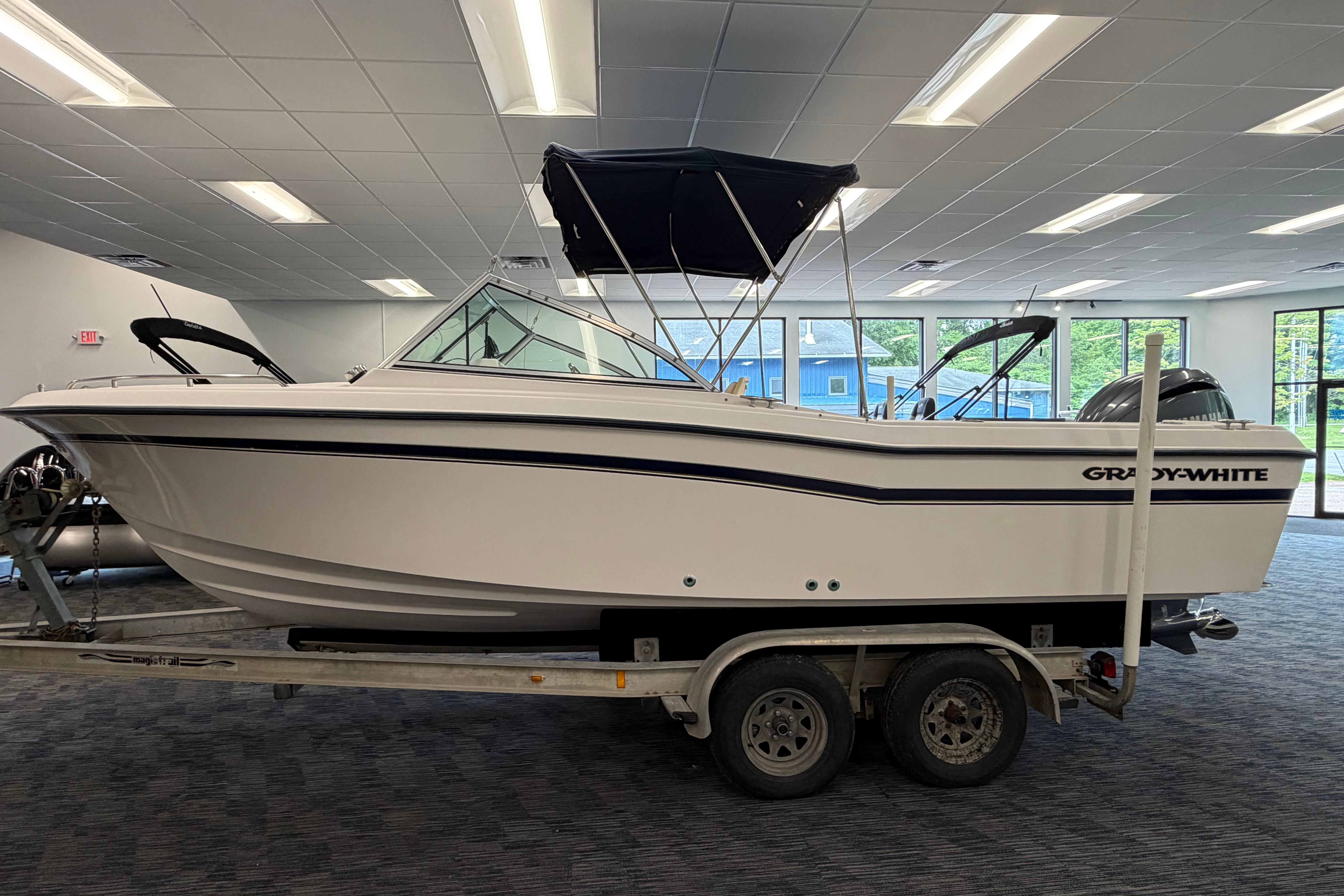 2001 Grady-White Tournament 223 boat on trailer in showroom.