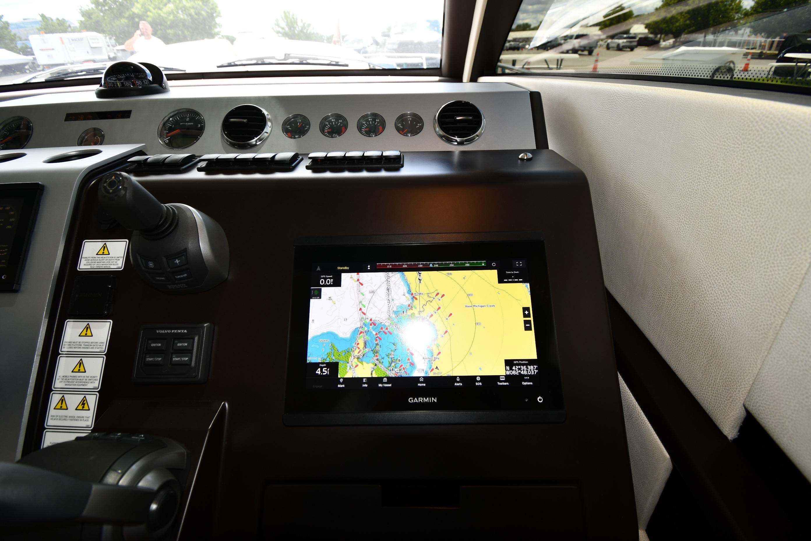 Dashboard of 2024 Fairline G50 Targa yacht with Garmin navigation display.