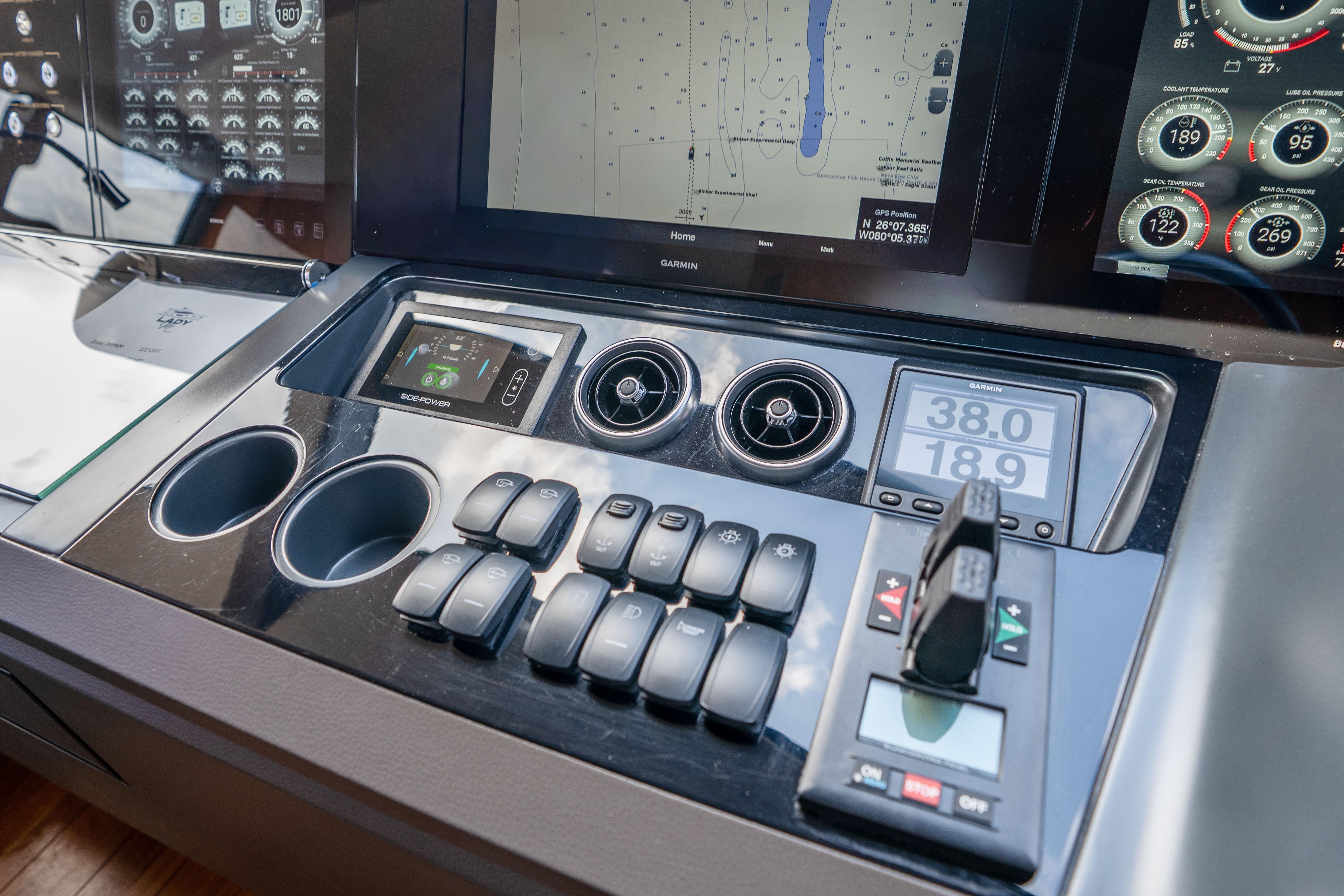 Control panel of a 2020 Princess Y85 yacht with navigation and monitoring displays.