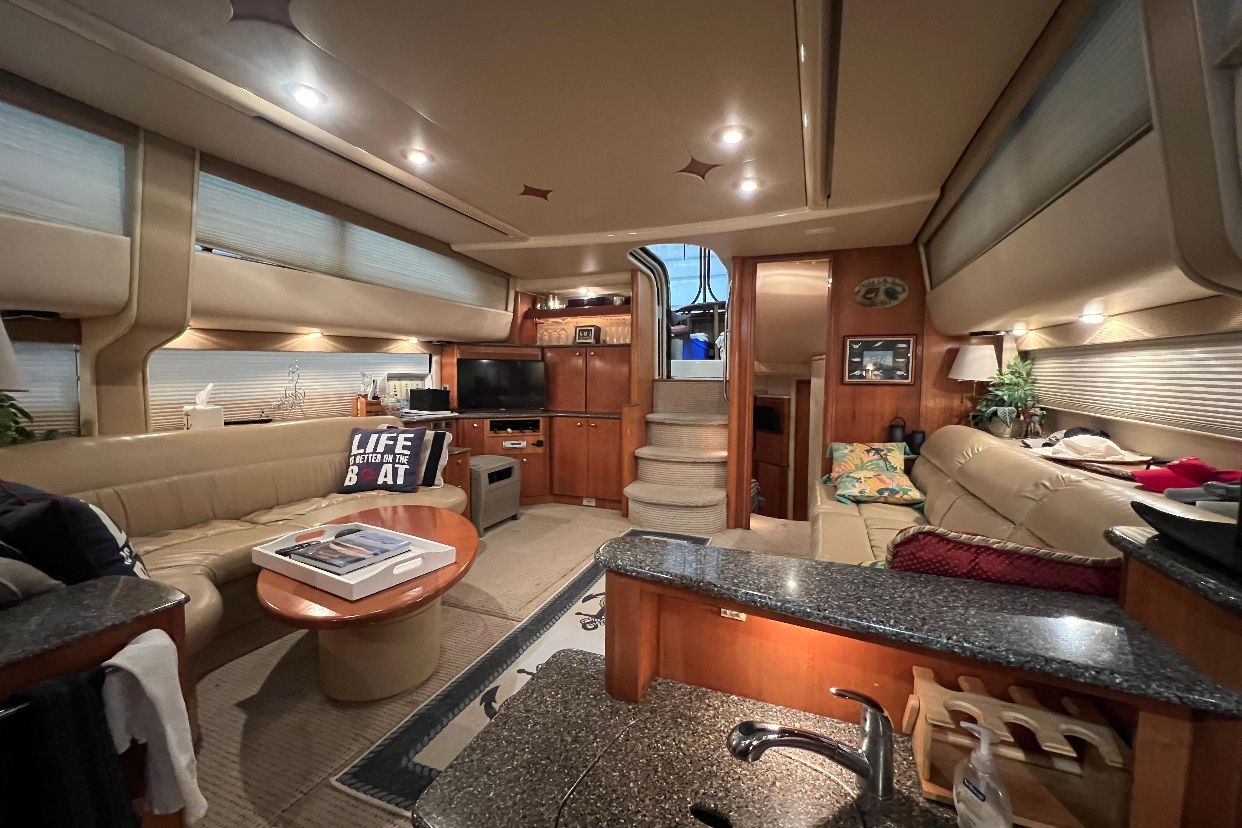 Luxurious interior of a 2004 Meridian 408 Motoryacht with cozy seating and modern amenities.