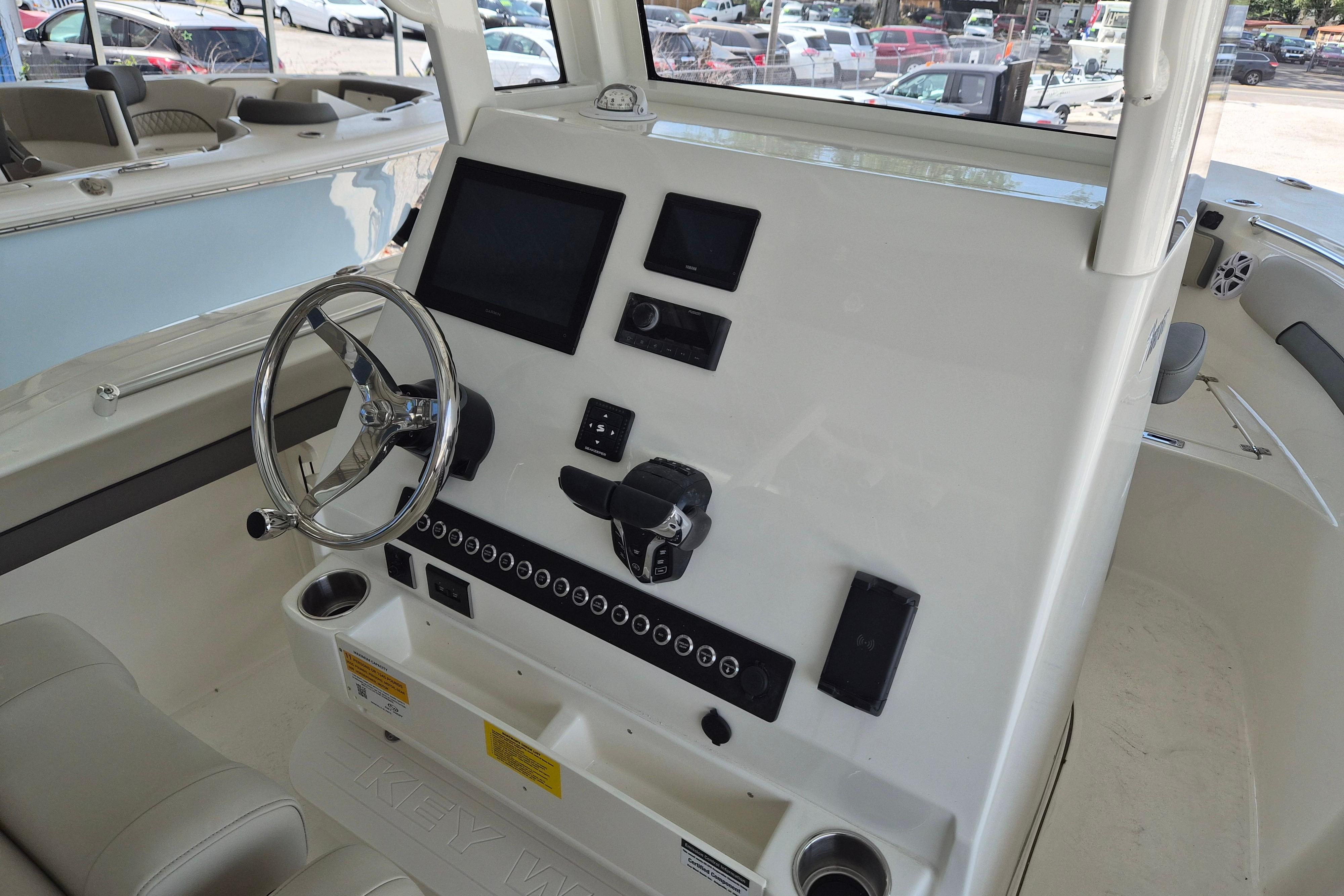 2026 Key West 260 Center Console boat dashboard with steering wheel and electronic controls.
