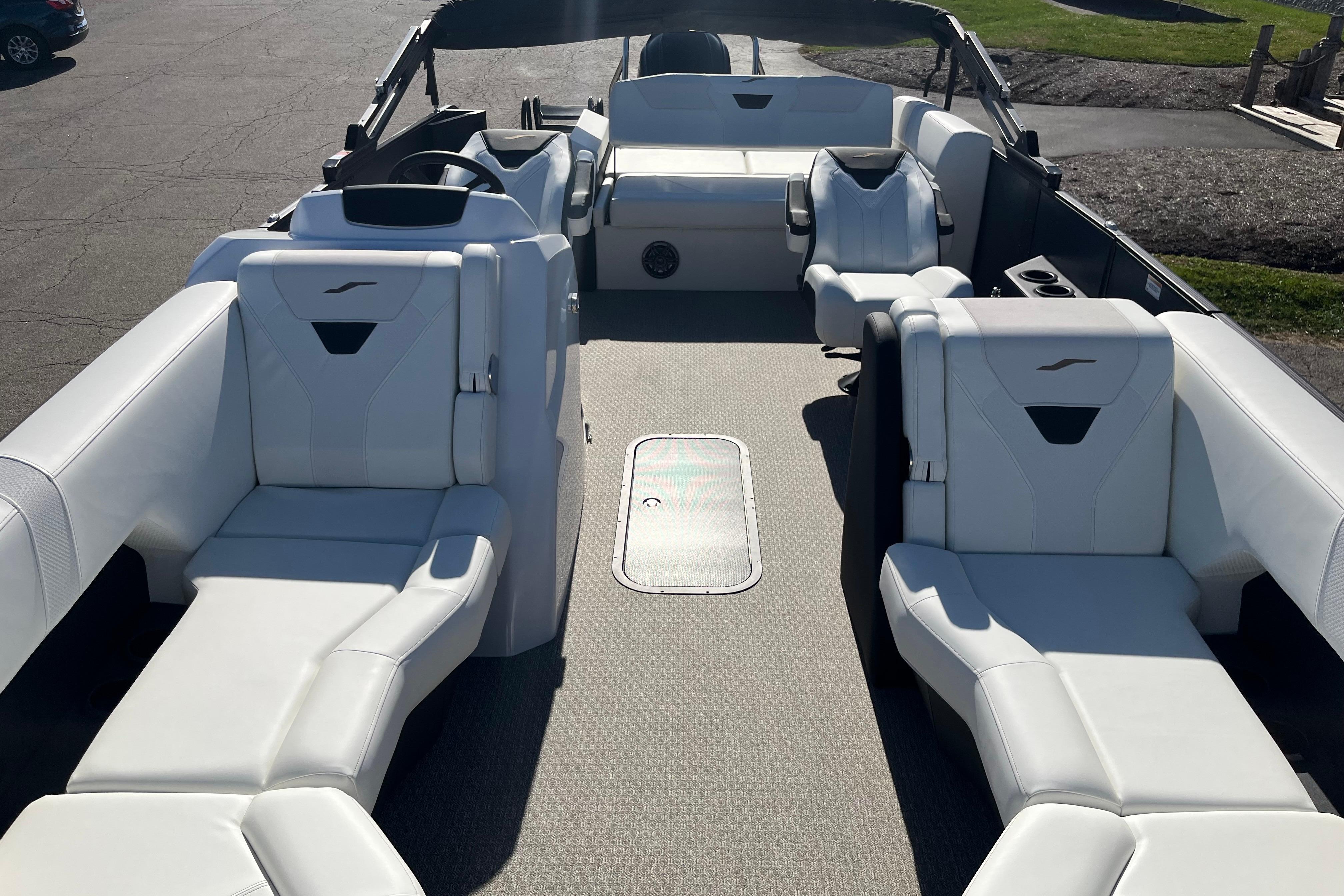 Luxurious interior of 2026 Evotti 523CS boat with white seating and modern design.