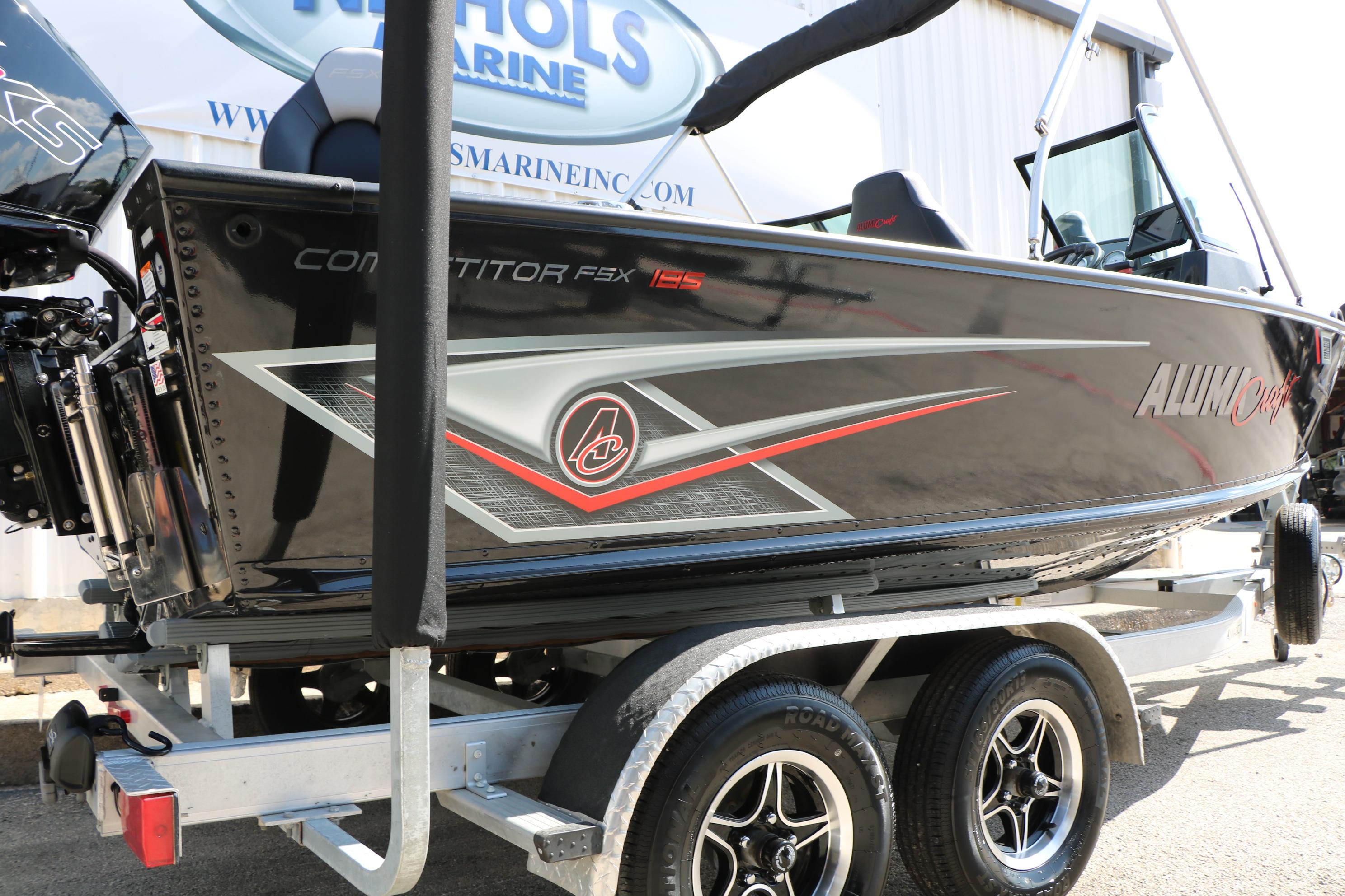 2023 Alumacraft Competitor FSX 185 boat on trailer, side view.