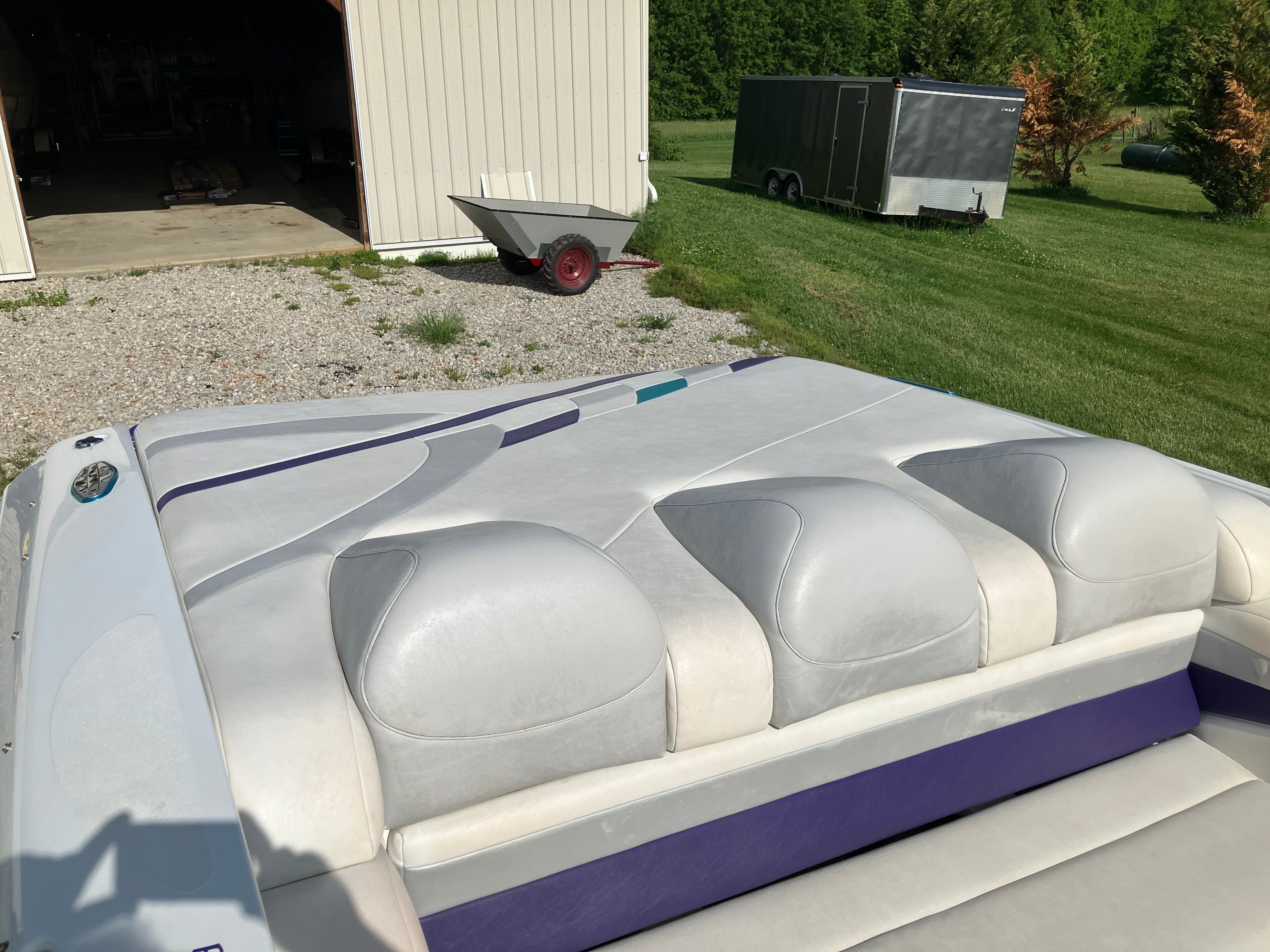 Baja 36 Outlaw 2000 on a lawn beside a shed.