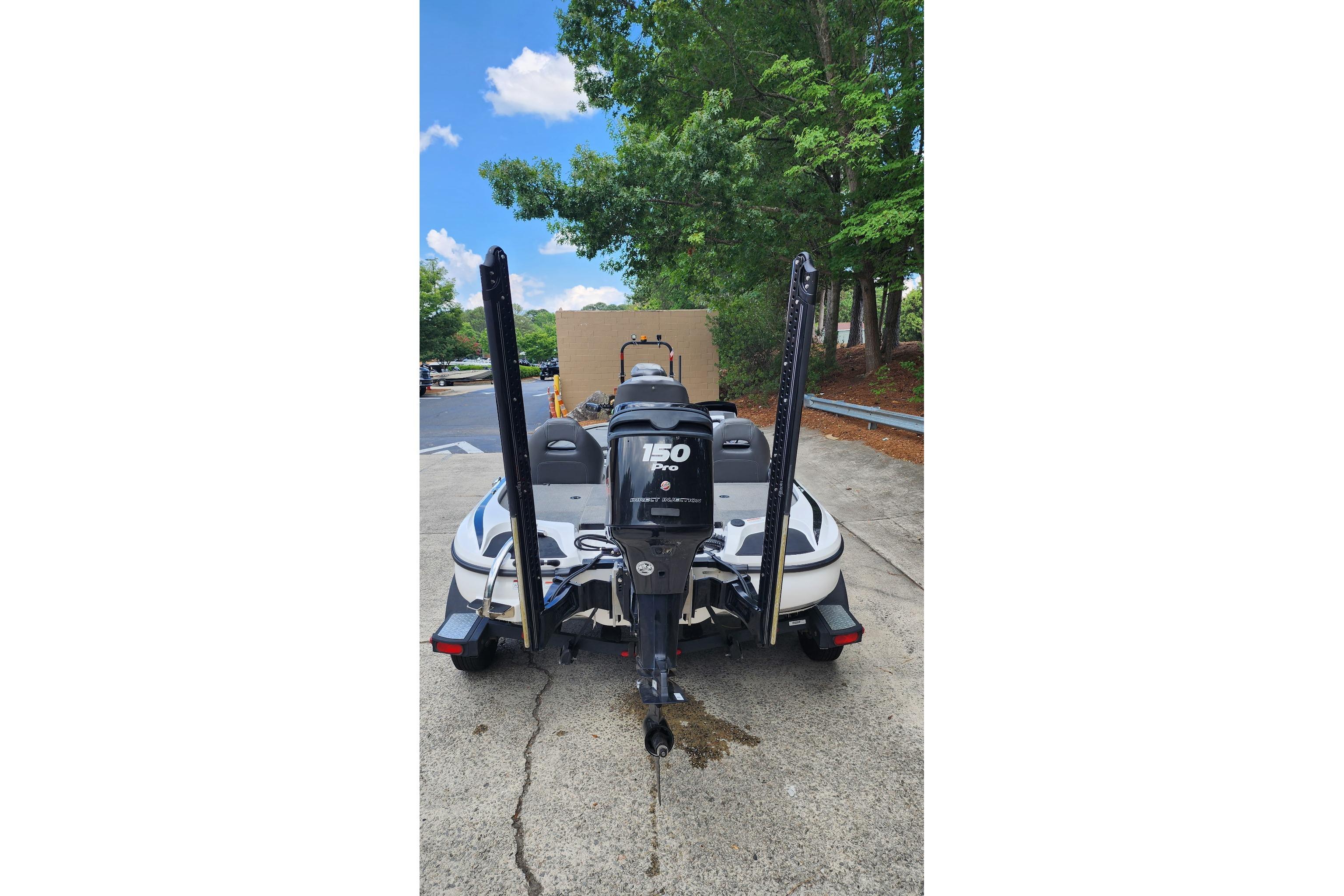 2017 Nitro Z18 boat with 150 horsepower engine, parked outdoors near trees.
