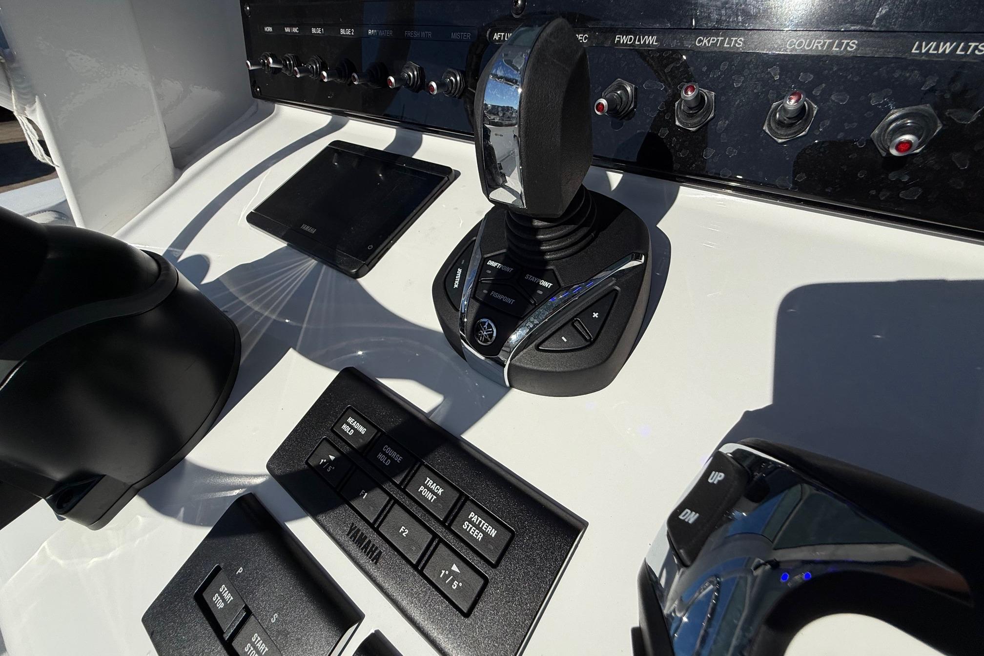 Control panel of 2026 Sea Hunt Ultra 275 Coffin Box boat with joystick and switches.