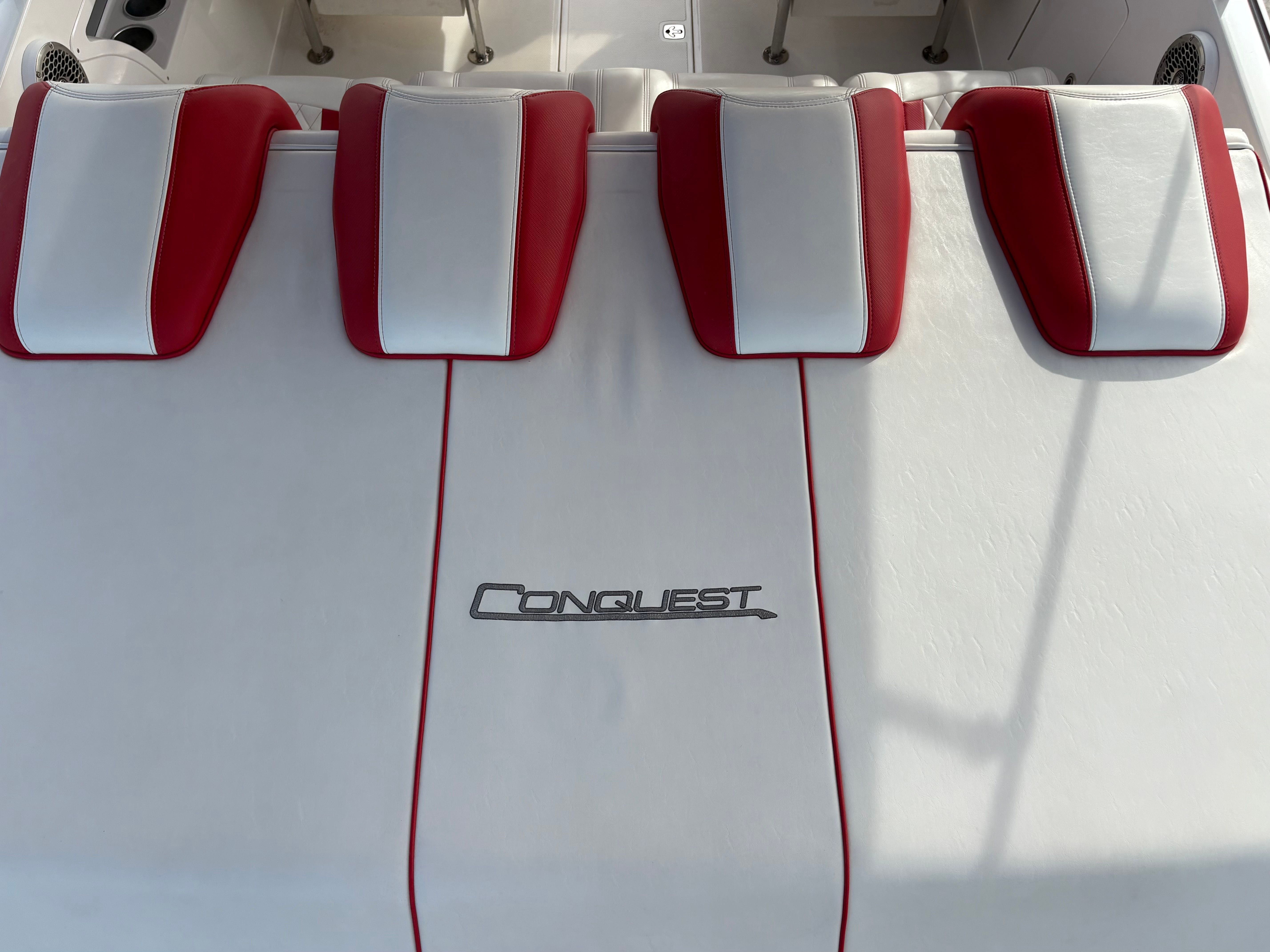 Conquest 28’ Top Cat II Deck Boat, red and white seats, 2022 model.