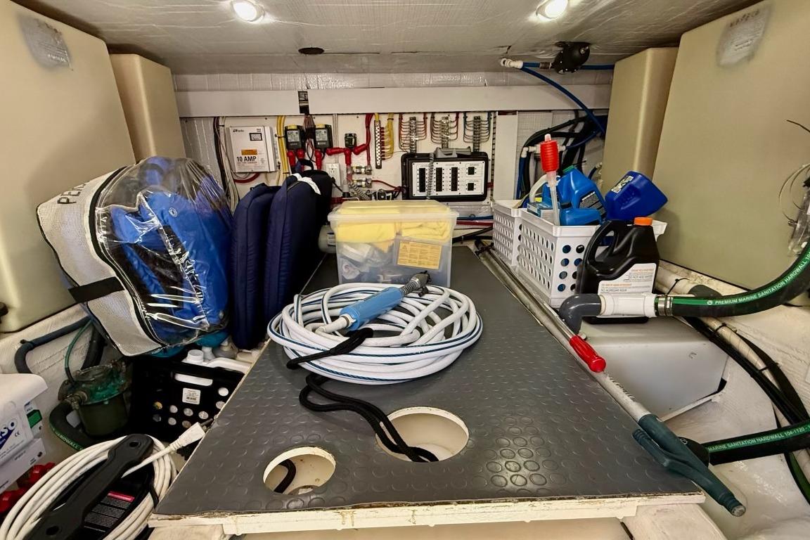 Storage area in a 2015 Sabre 38 Salon Express, featuring organized boating equipment.
