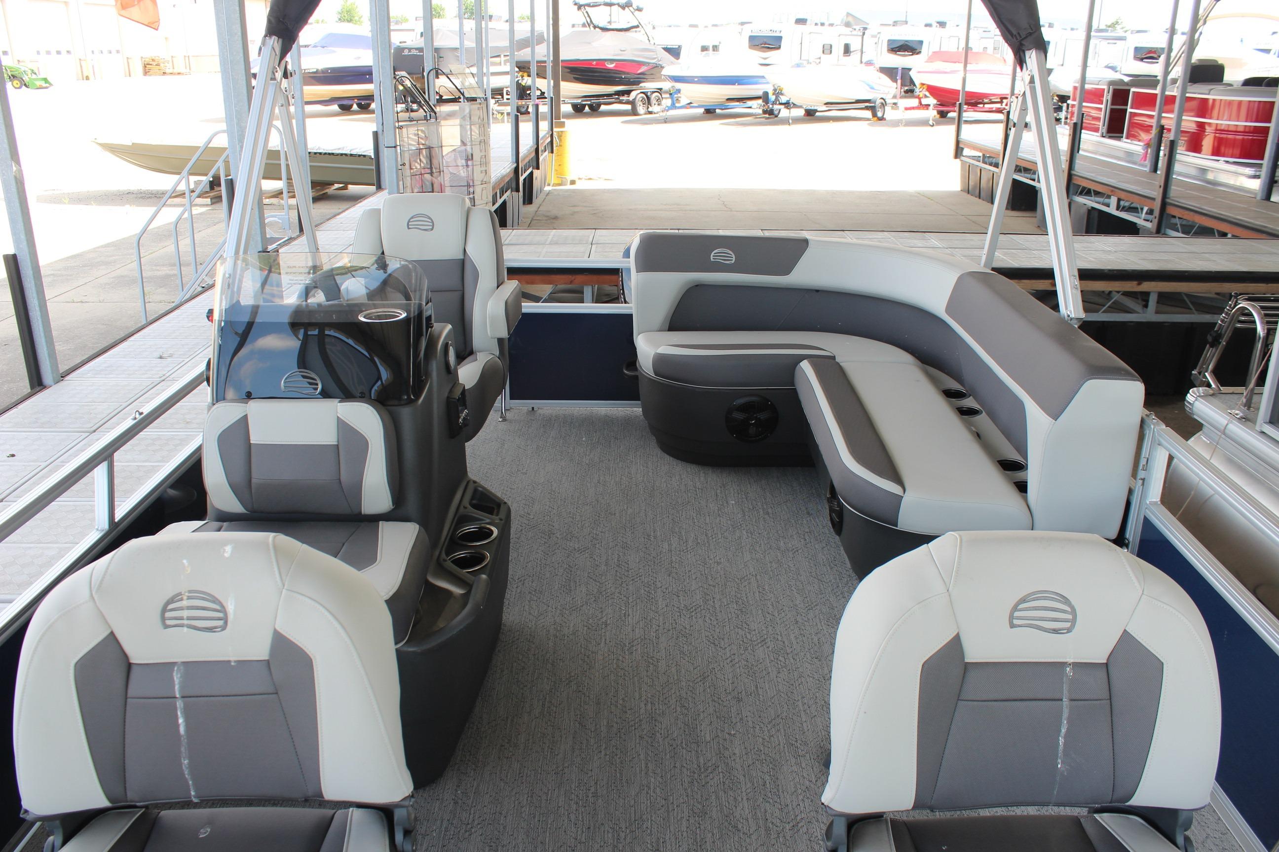 2026 Sun Tracker Bass Buggy 16 XL Select pontoon boat interior with seating and helm.