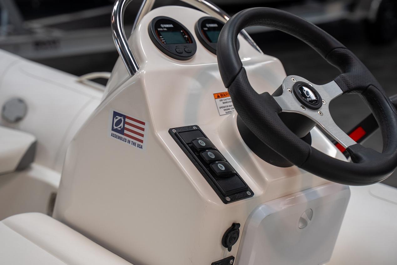 Steering console of 2026 Zodiac Yachtline 360 with controls and USA assembly label.