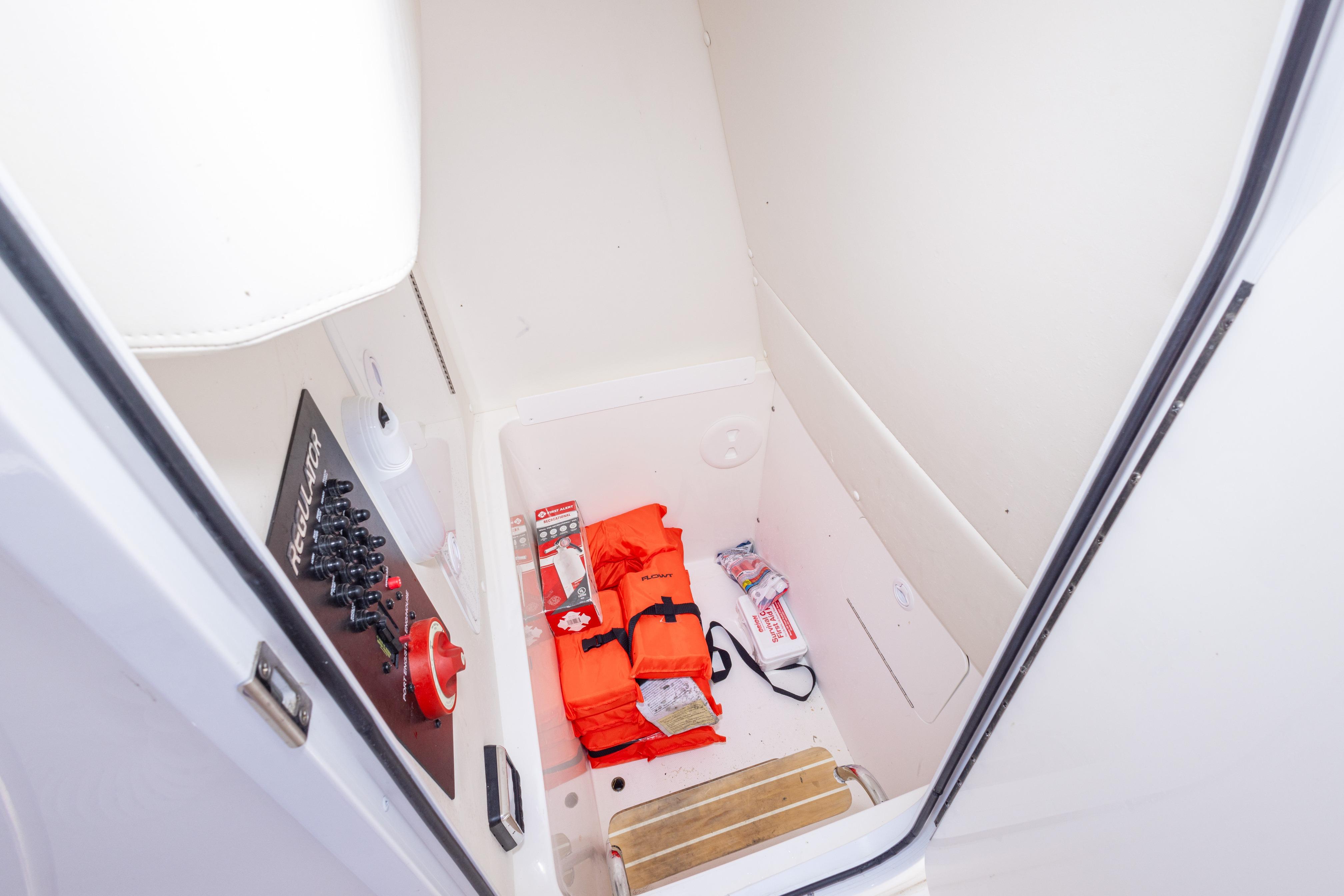 2019 Regulator 23 Center Console storage with life jackets and safety equipment.