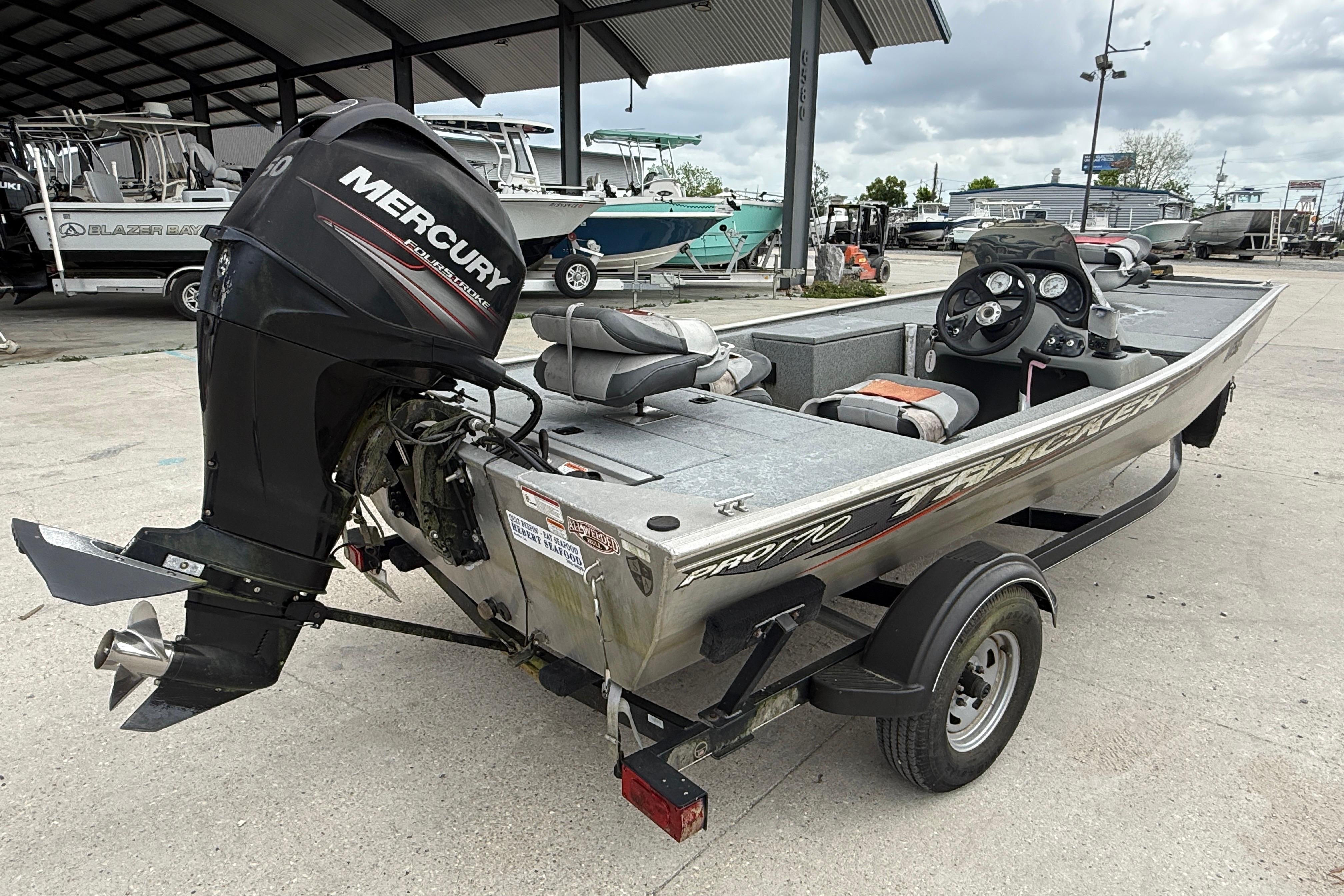 2016 Tracker Pro 170 boat with Mercury outboard motor on trailer.