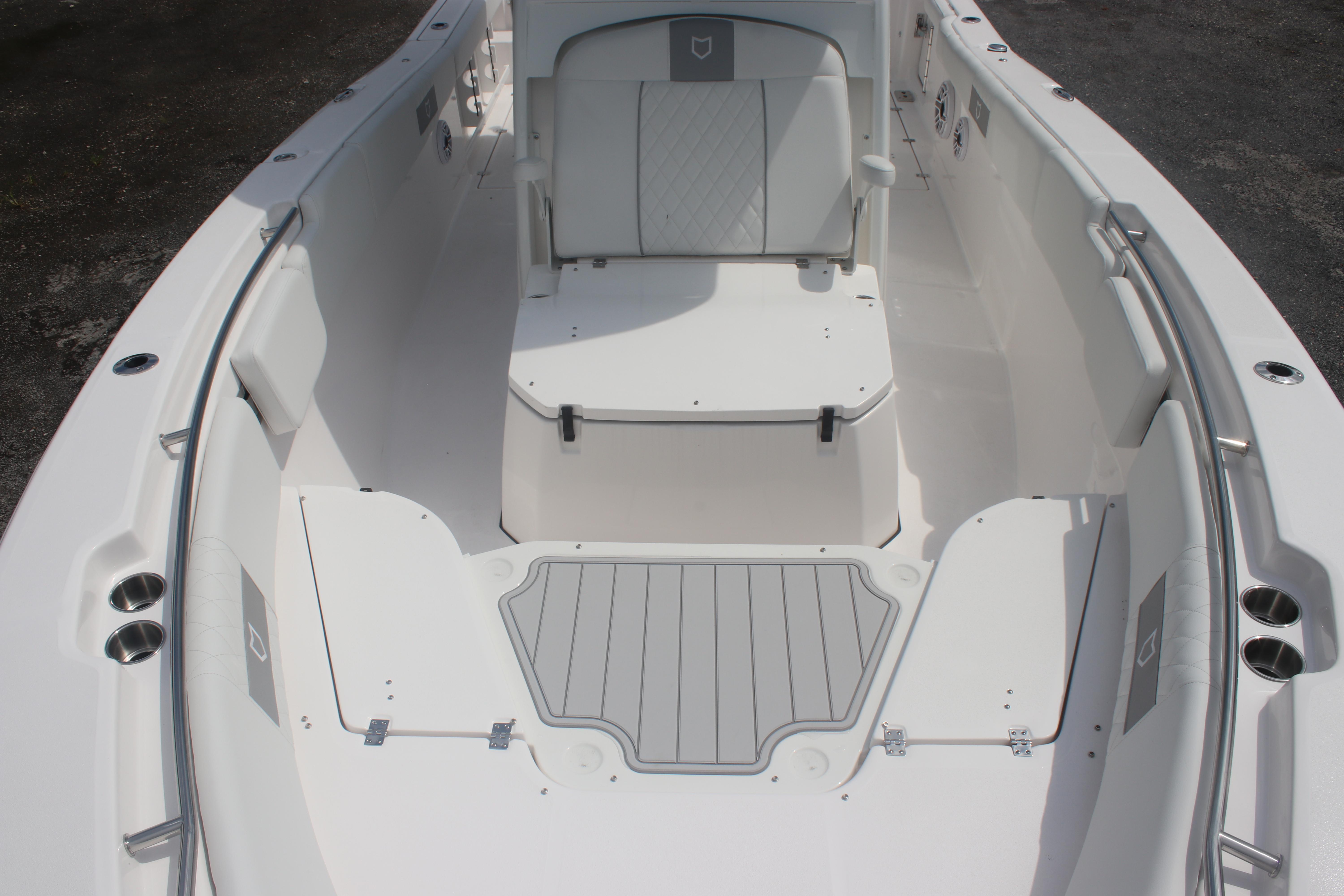 2026 Sea Fox 288 Commander boat interior with seating and storage compartments.