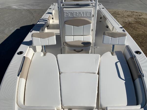 2024 Robalo 226 Cayman boat interior with cushioned seating and storage compartments.