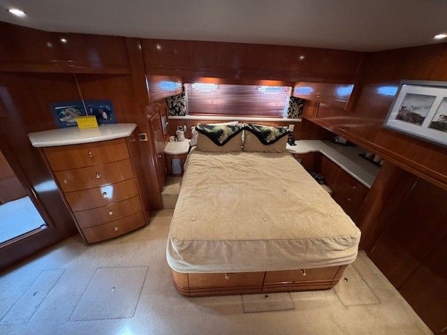 Luxurious bedroom in a 2002 Carver 570 Voyager Pilothouse yacht.