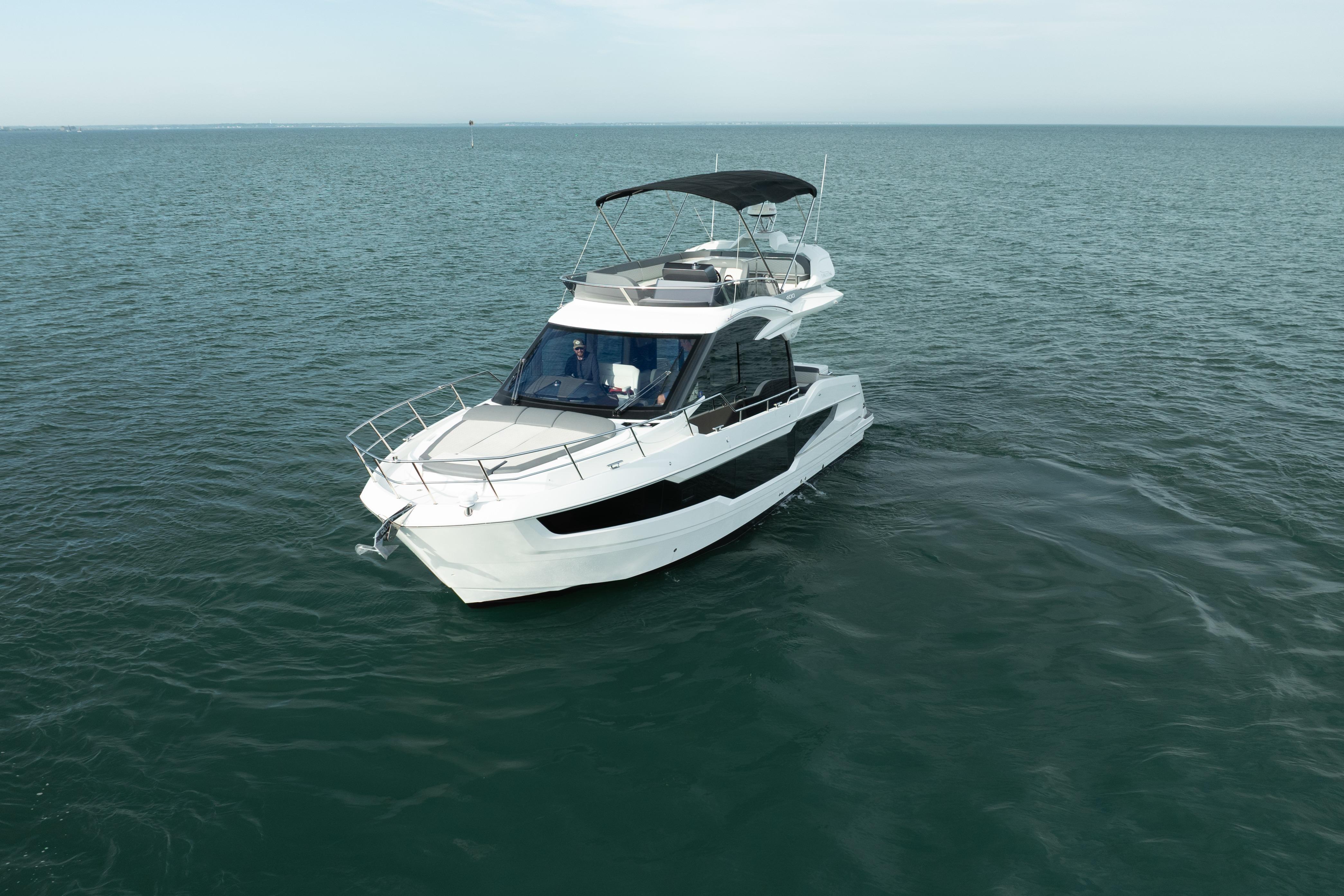 2023 Galeon 400 Fly yacht cruising on open water.