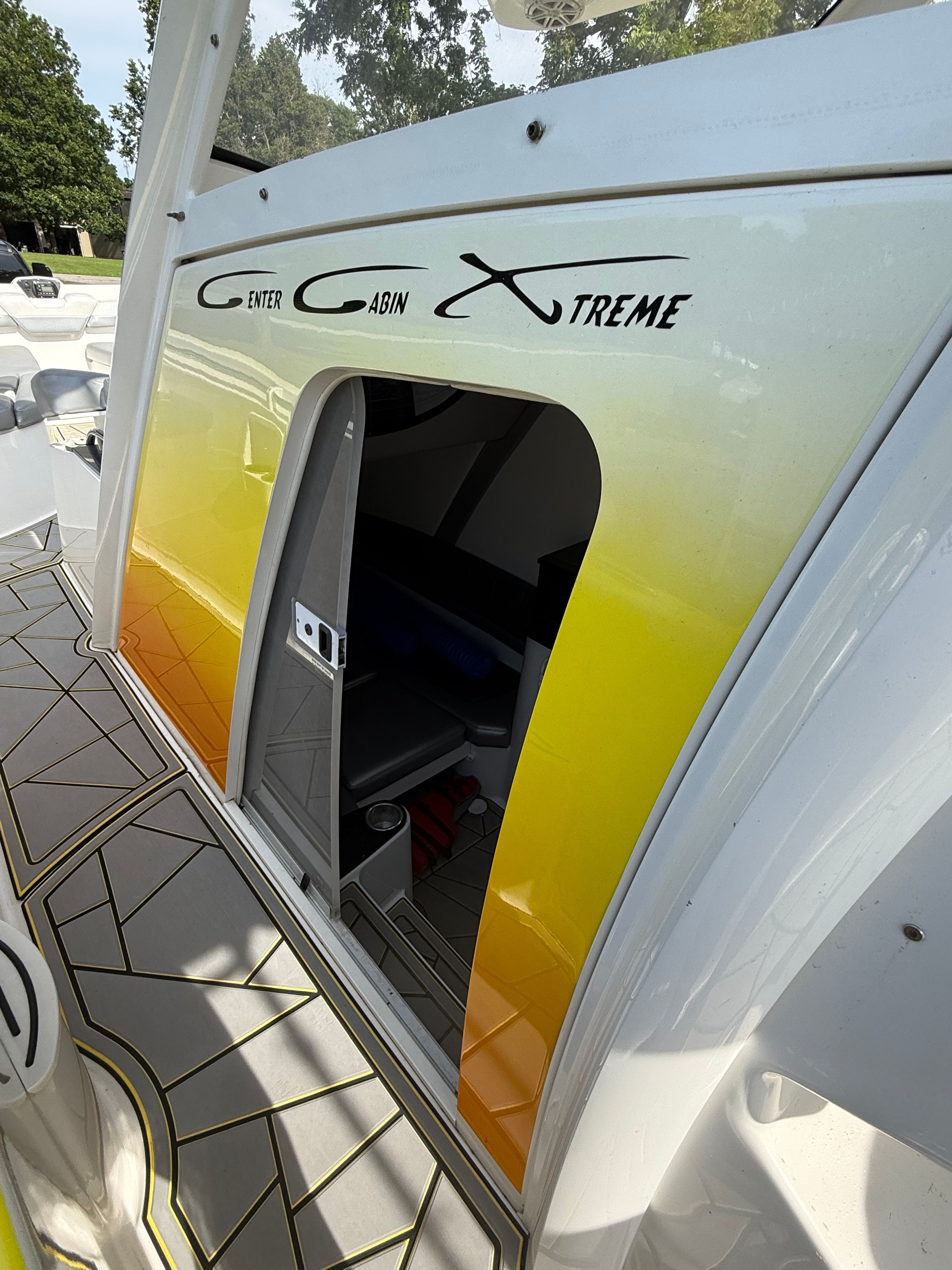 Entrance to the cabin of a 2014 Sunsation 34 CCX with yellow and white design.