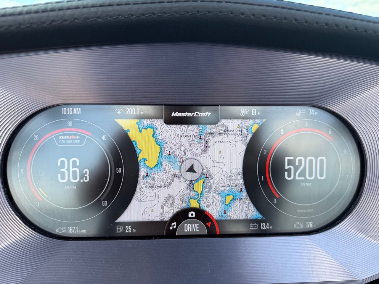 MasterCraft X24 2023 dashboard displaying speed and RPM gauges.