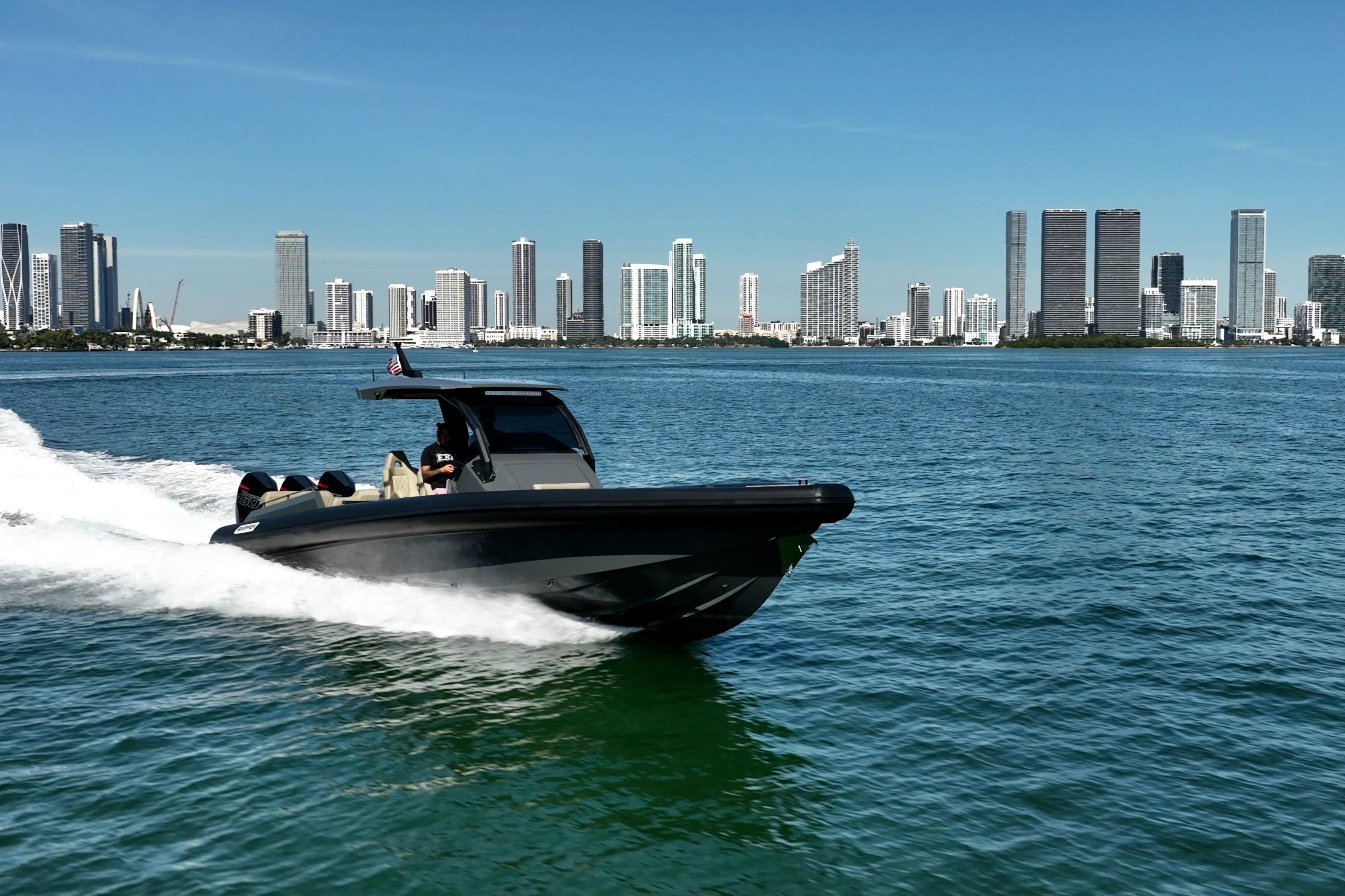 2023 Skipper-BSK 38NC boat cruising on water with city skyline backdrop.