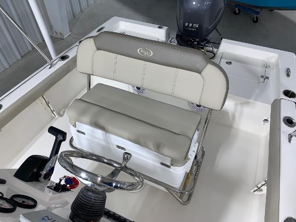 2026 Key West 188 Bay Reef boat interior with steering wheel and cushioned seating.