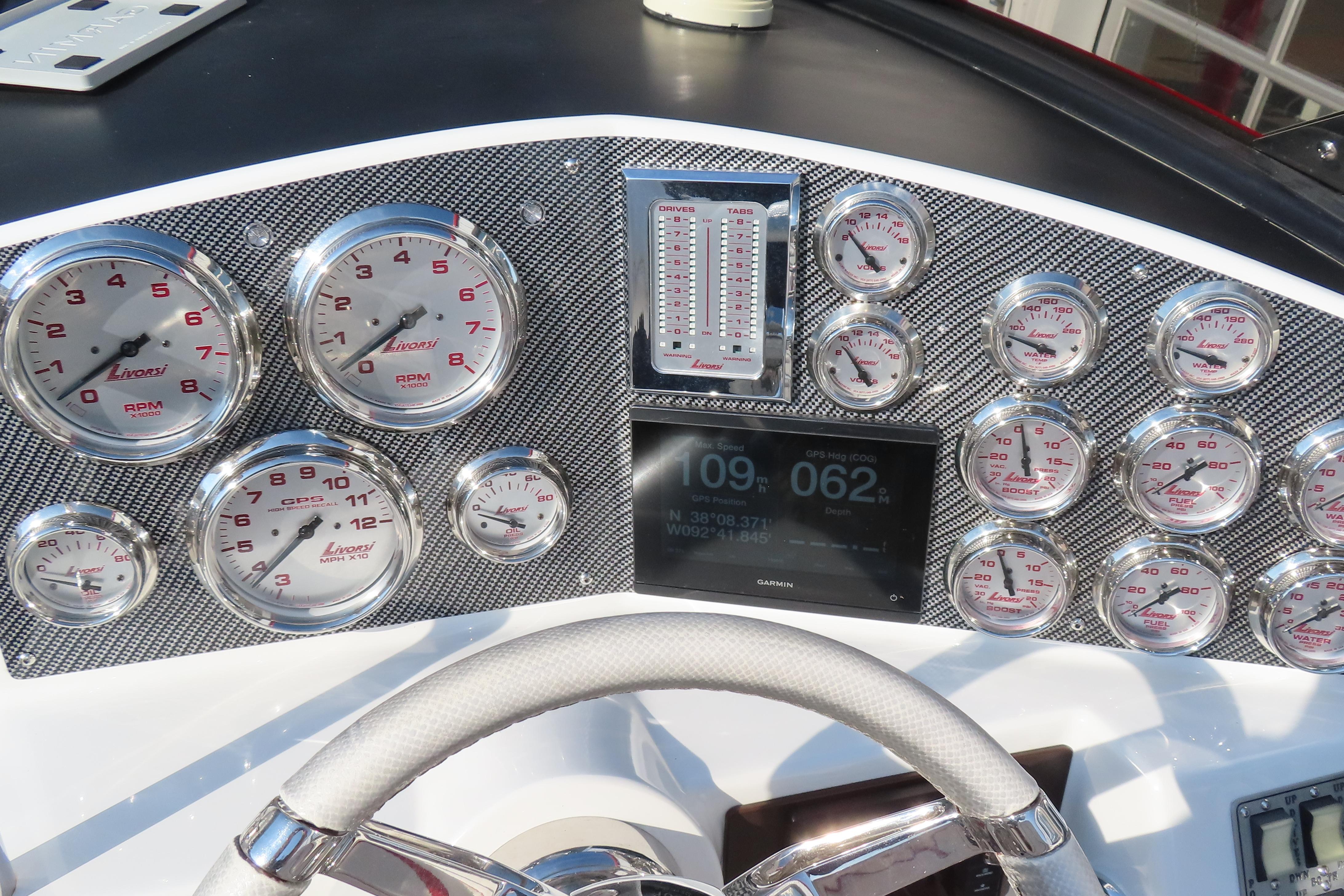 Dashboard of 2013 Nordic 39 POKER RUN boat with Livorsi gauges and Garmin display.