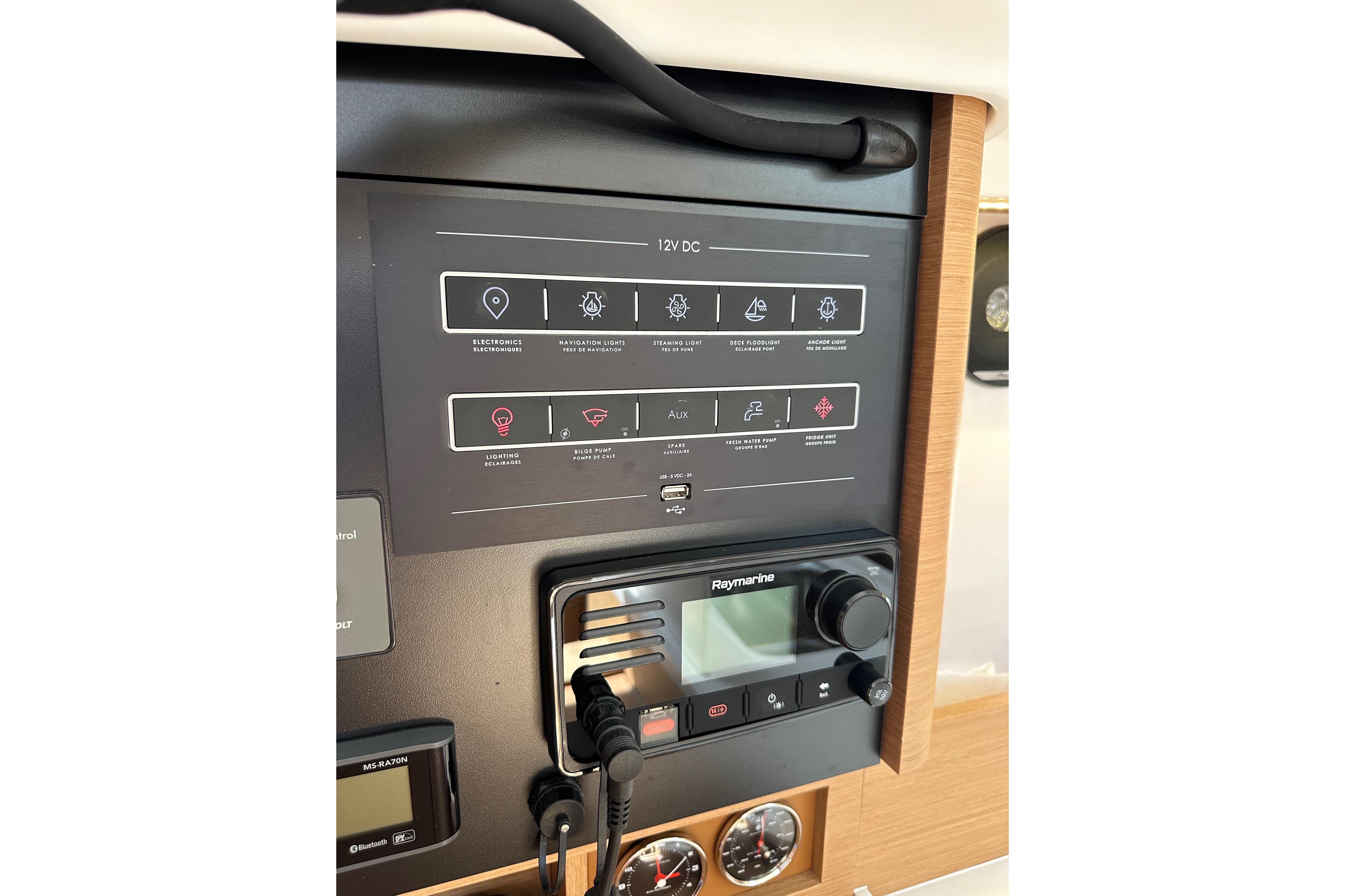Control panel of 2024 Jeanneau Sun Odyssey 410 sailboat with navigation and electronic systems.
