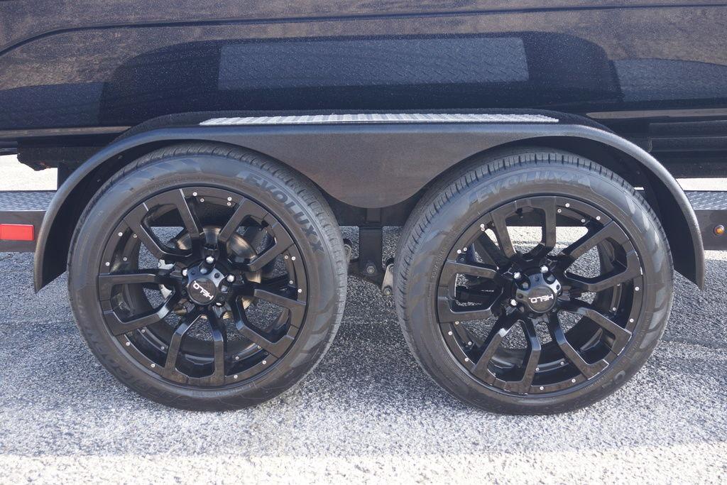 2025 Phoenix 921 Elite trailer with sleek black alloy wheels on asphalt surface.