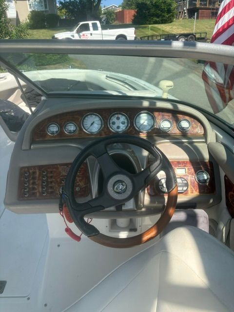 The image shows the cockpit of a 2003 Cobalt 240 boat with a sleek dashboard.