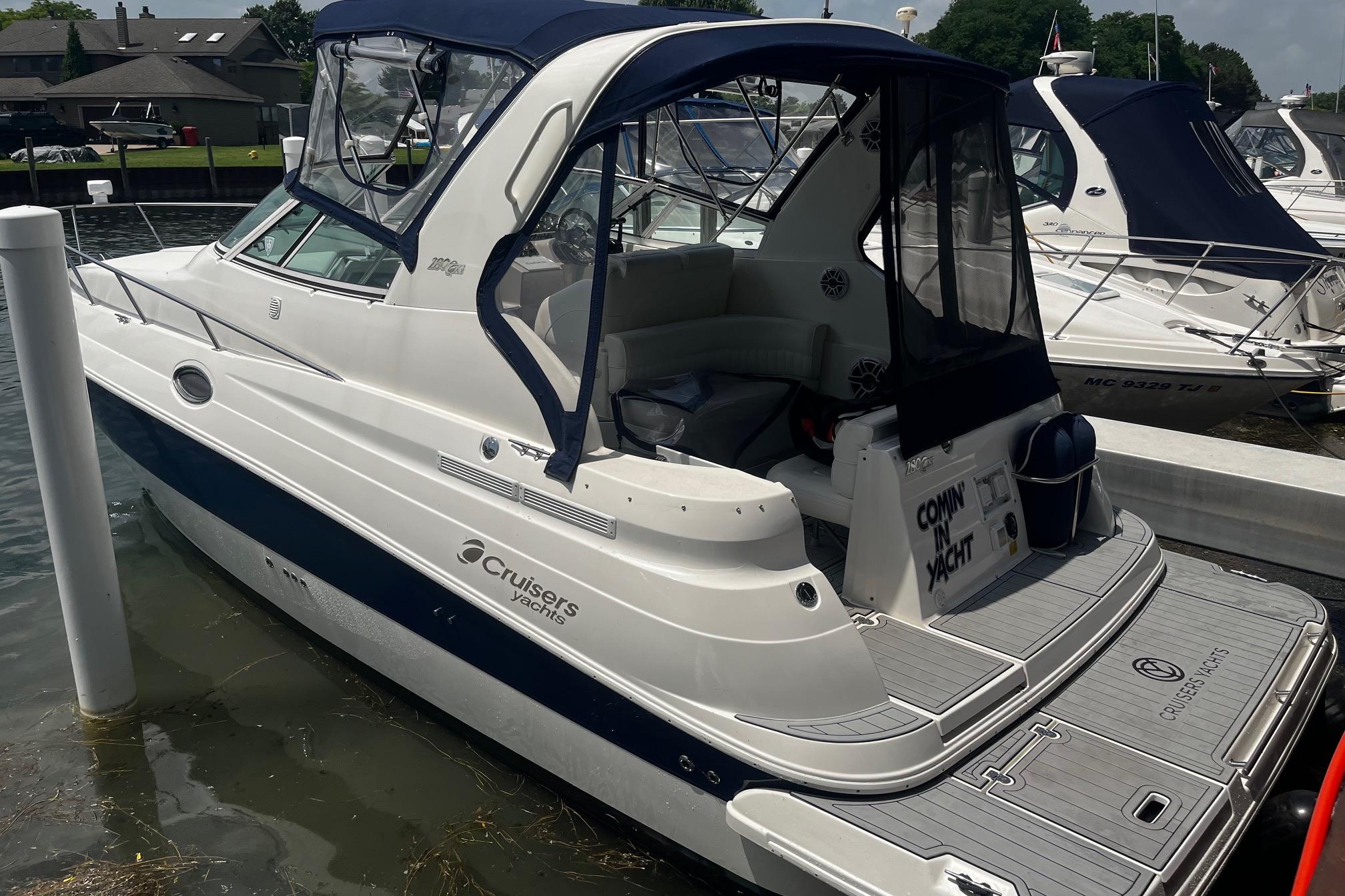 2004 Cruisers Yachts 280 CXi Express docked, featuring sleek design and spacious cockpit.