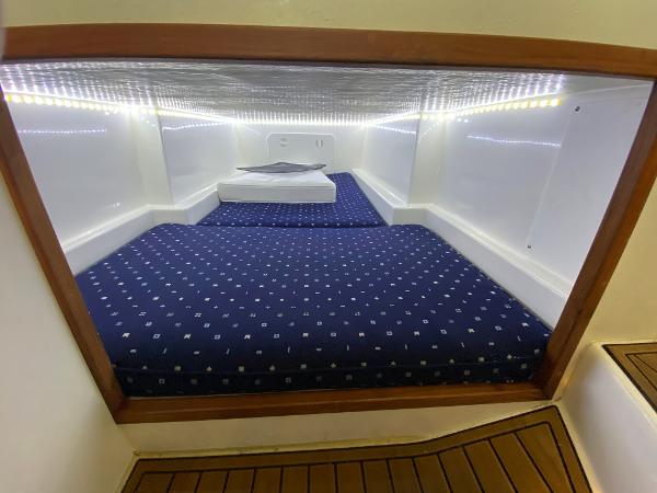 Cabin with blue upholstery and wood trim.