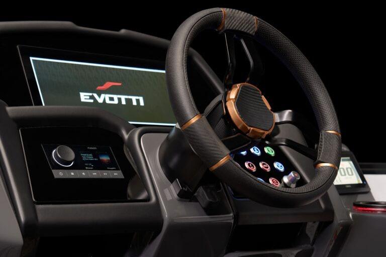 Manufacturer Provided Image: Steering wheel and dashboard of 2026 Evotti 721CS, featuring advanced controls and digital display.