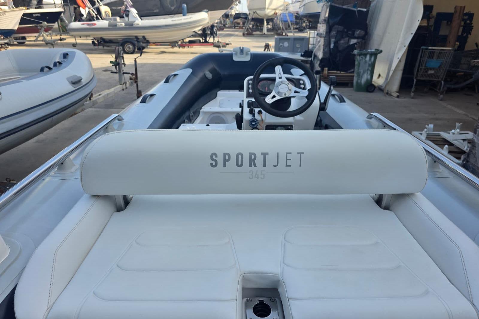 2021 Williams Jet Tenders Sportjet 345, white interior, docked in a marina.