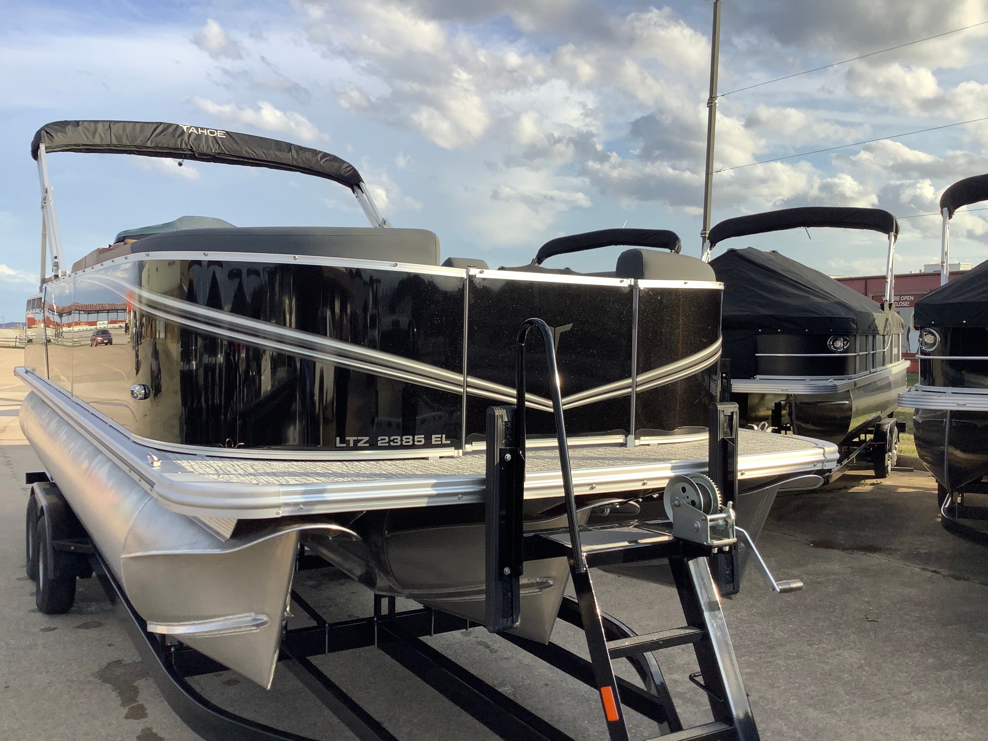 2026 Tahoe 2385 LTZ pontoon boat on trailer, sunny day.