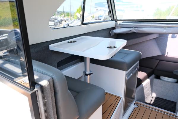 Interior of 2023 Makaira Gen3 800 boat with seating and table.