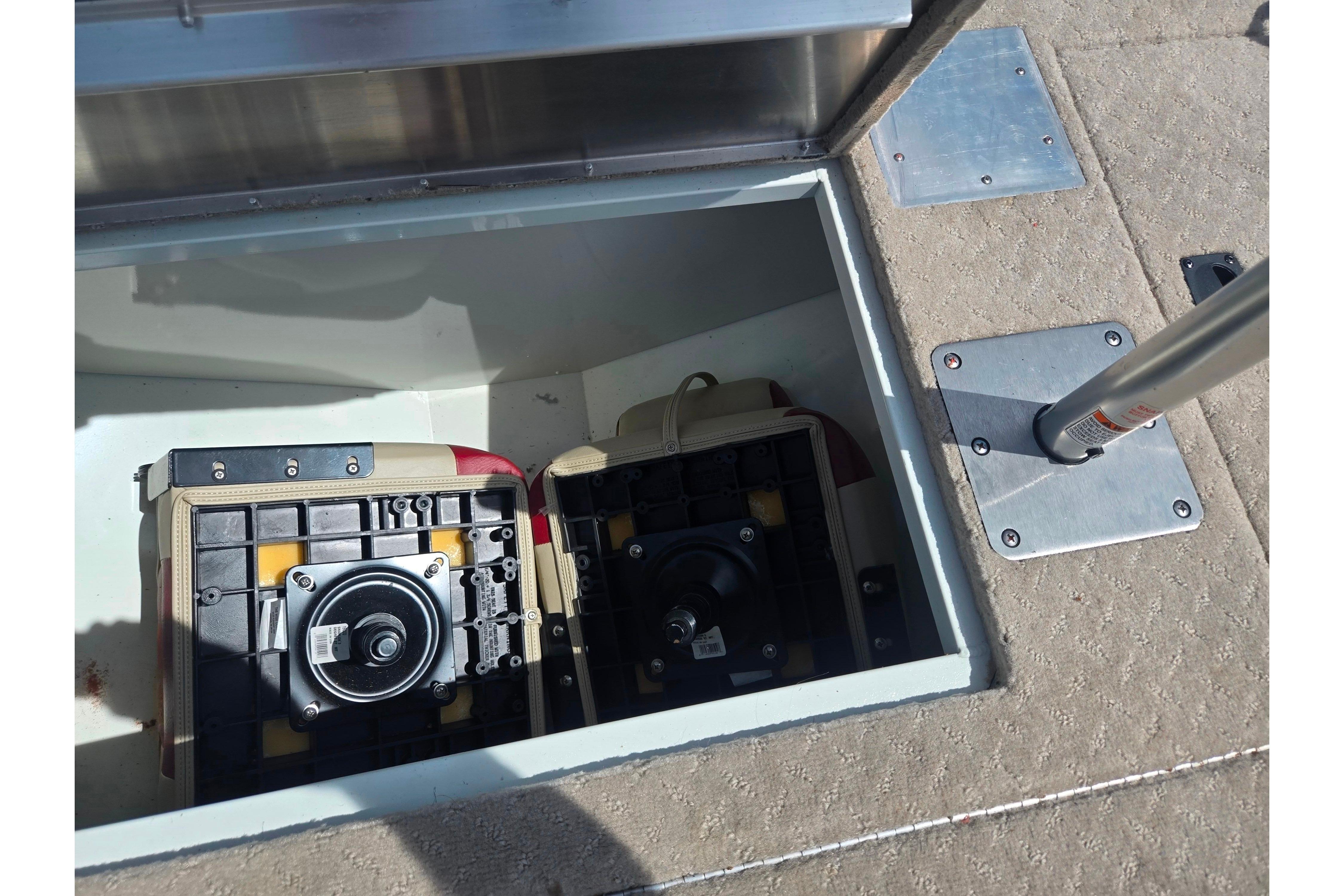 2015 Lowe Sport Deck 224 storage compartment with equipment and pole mount.