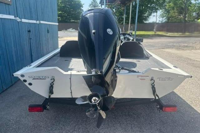 2021 Tracker Pro Team 175 TXW Tournament Edition boat, rear view with motor, parked outdoors.