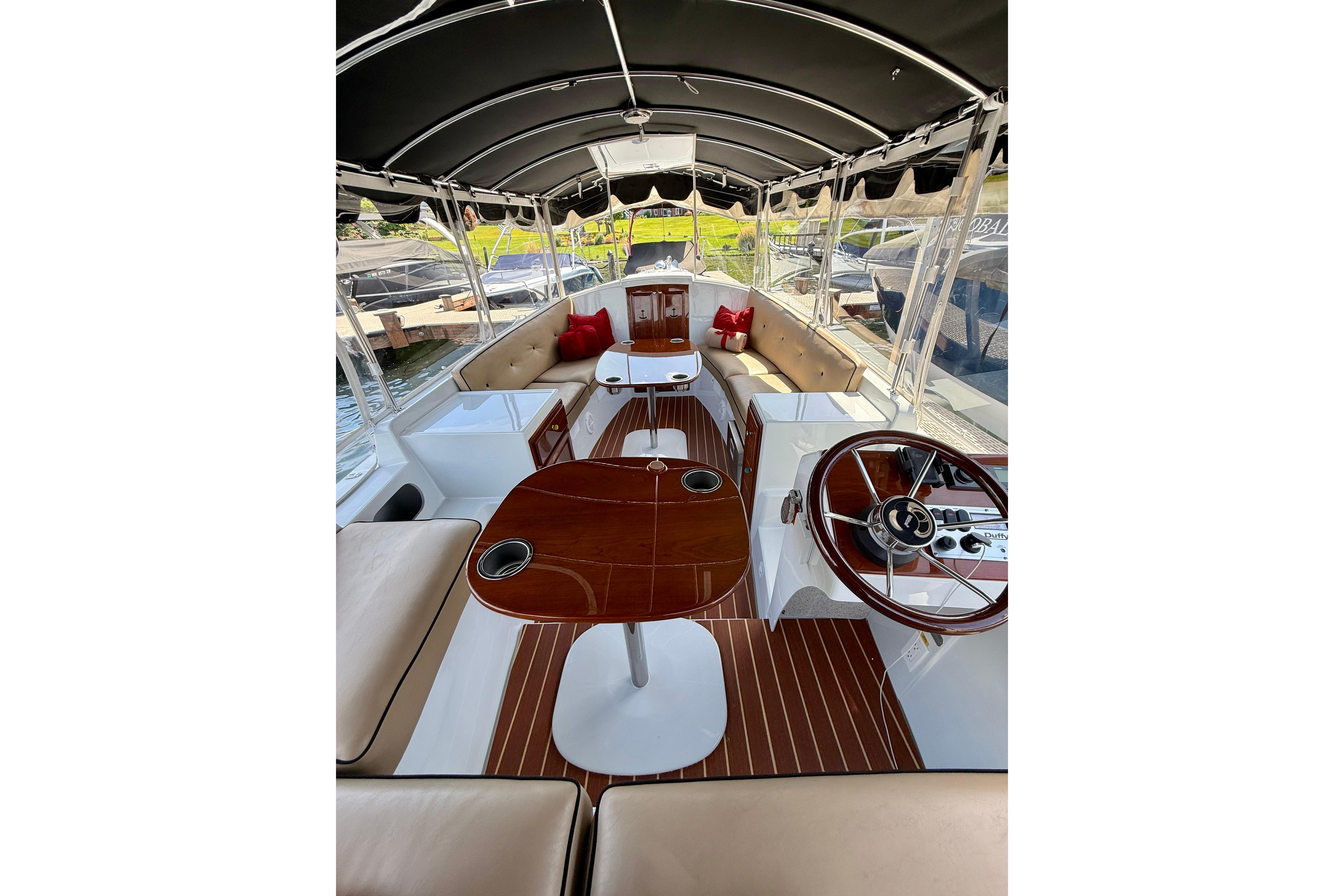 2017 Duffy Cuddy Cabin boat interior with elegant seating and polished wood accents.