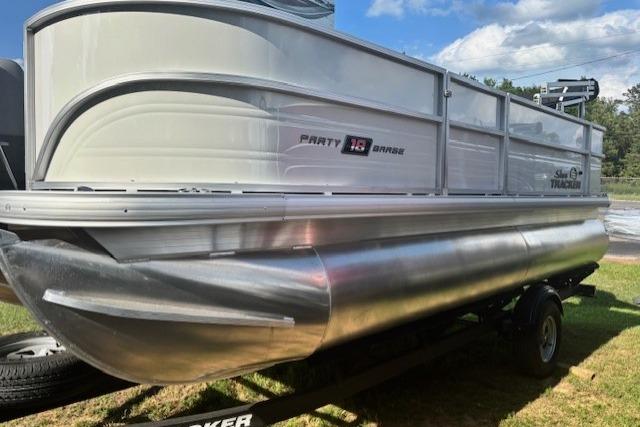 2026 Sun Tracker Party Barge 18 DLX pontoon boat on trailer, side view.