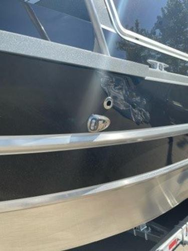 2025 Spartan 2600 Olympia boat with sleek black exterior and metallic accents.