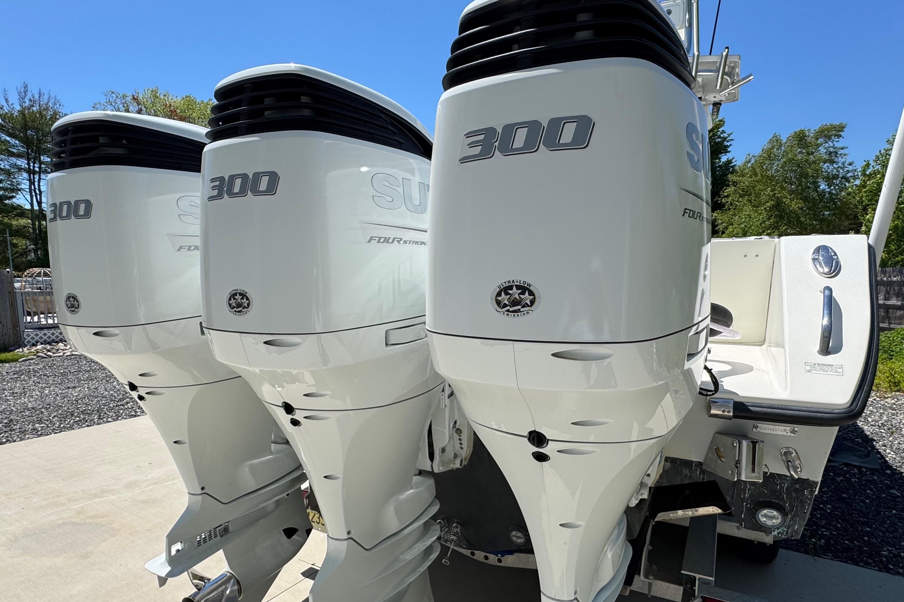Triple outboard motors on a 2020 Sea-Lion 34 TE boat, showcasing power and performance.