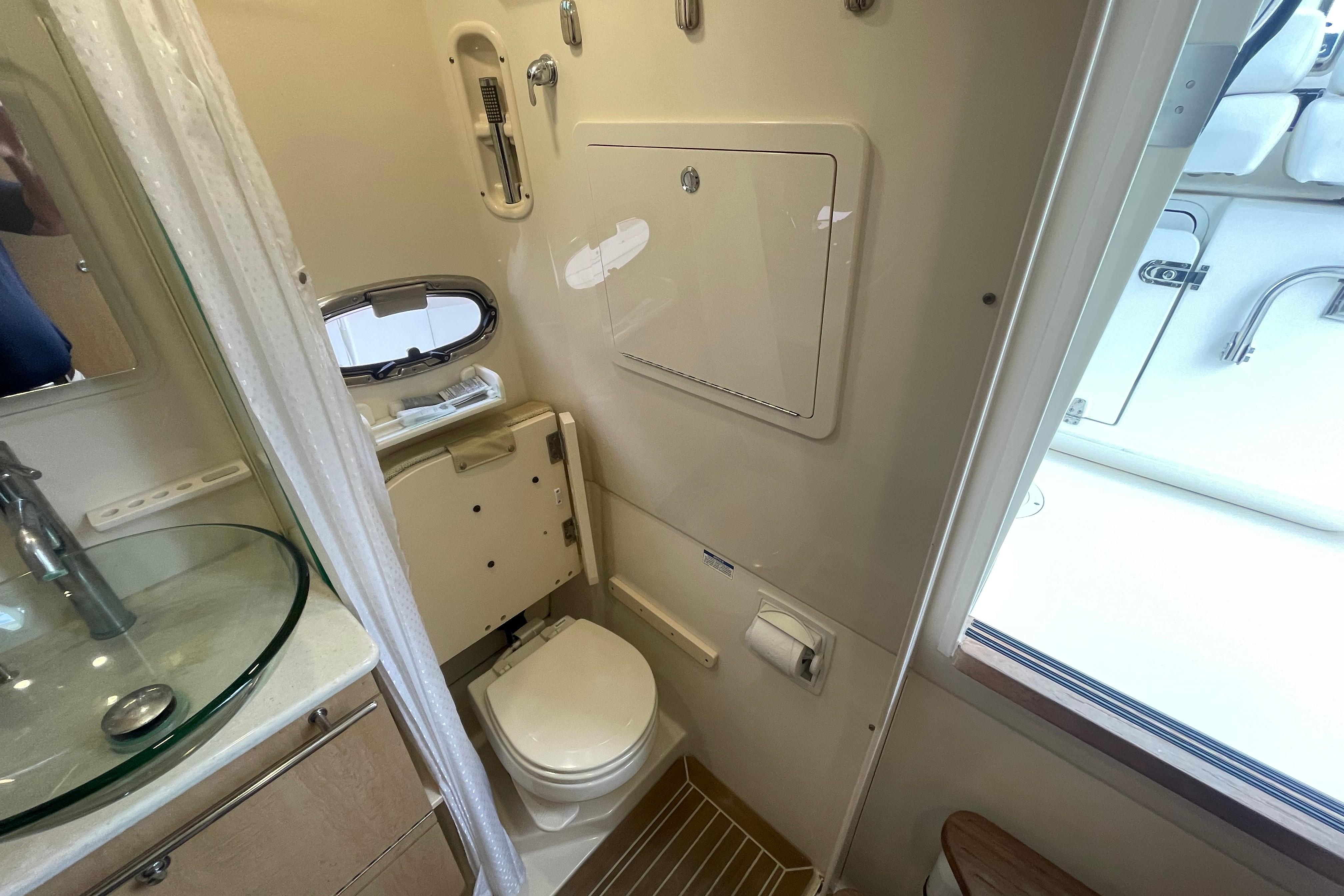 Interior of 2015 Boston Whaler 370 Outrage boat bathroom with modern fixtures.