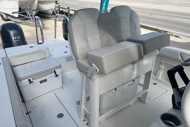 2025 World Cat 235 TE boat interior with cushioned seating and Yeti cooler.