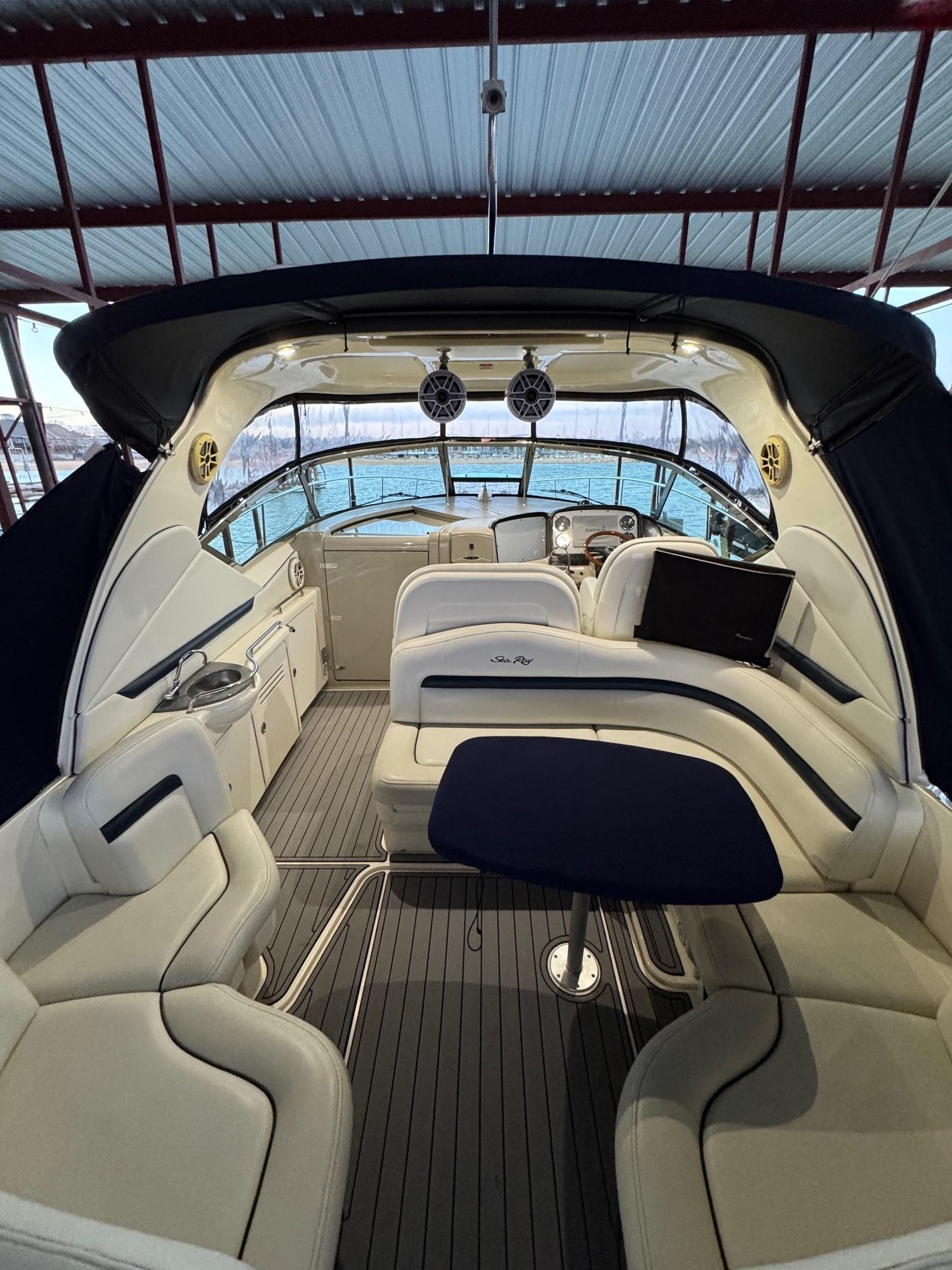 Interior of a 2007 Sea Ray 38 Sundancer yacht with luxurious seating and helm.