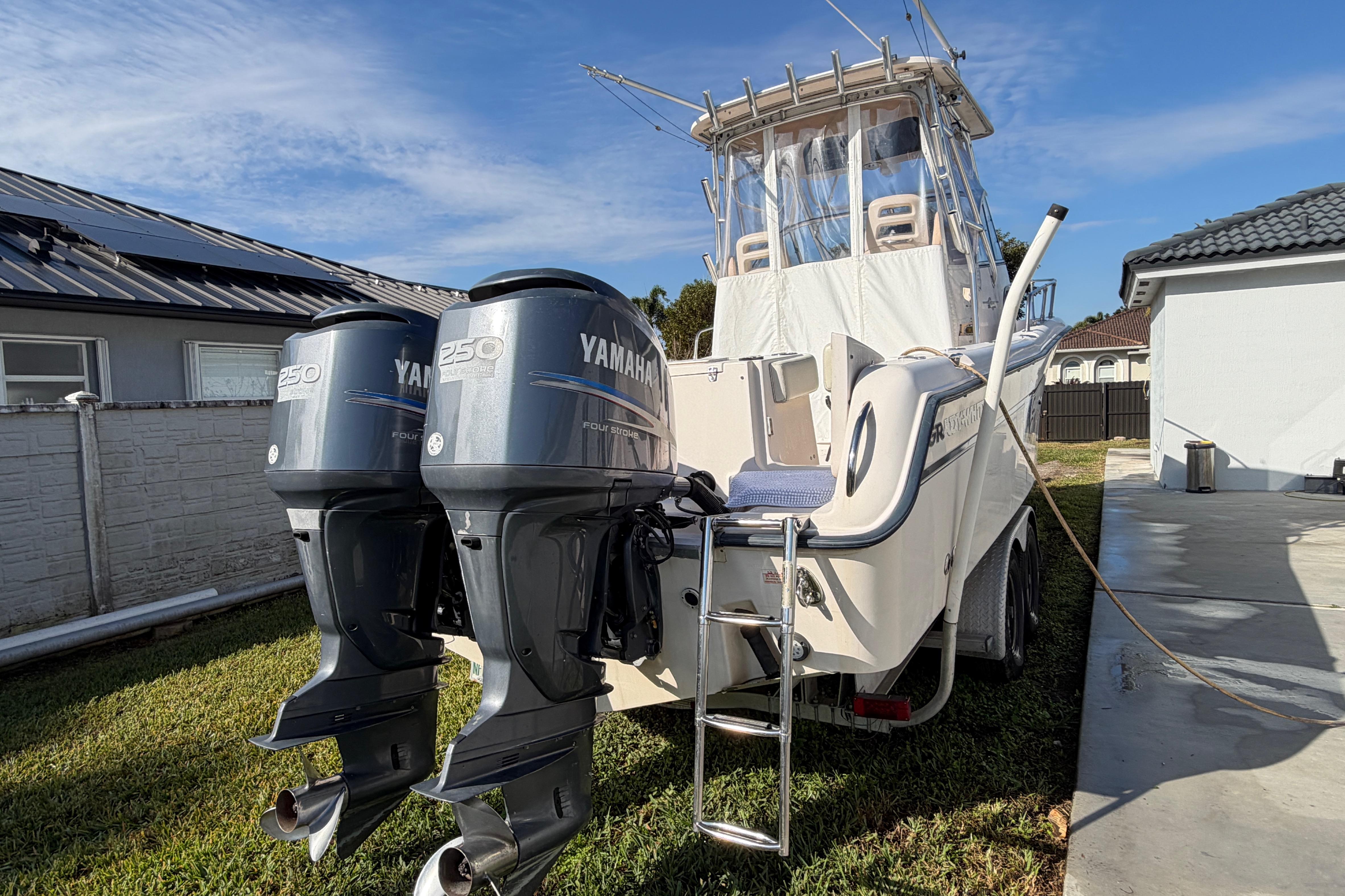 2006 Grady-White Sailfish 282 boat with twin Yamaha 250 engines, parked outdoors.